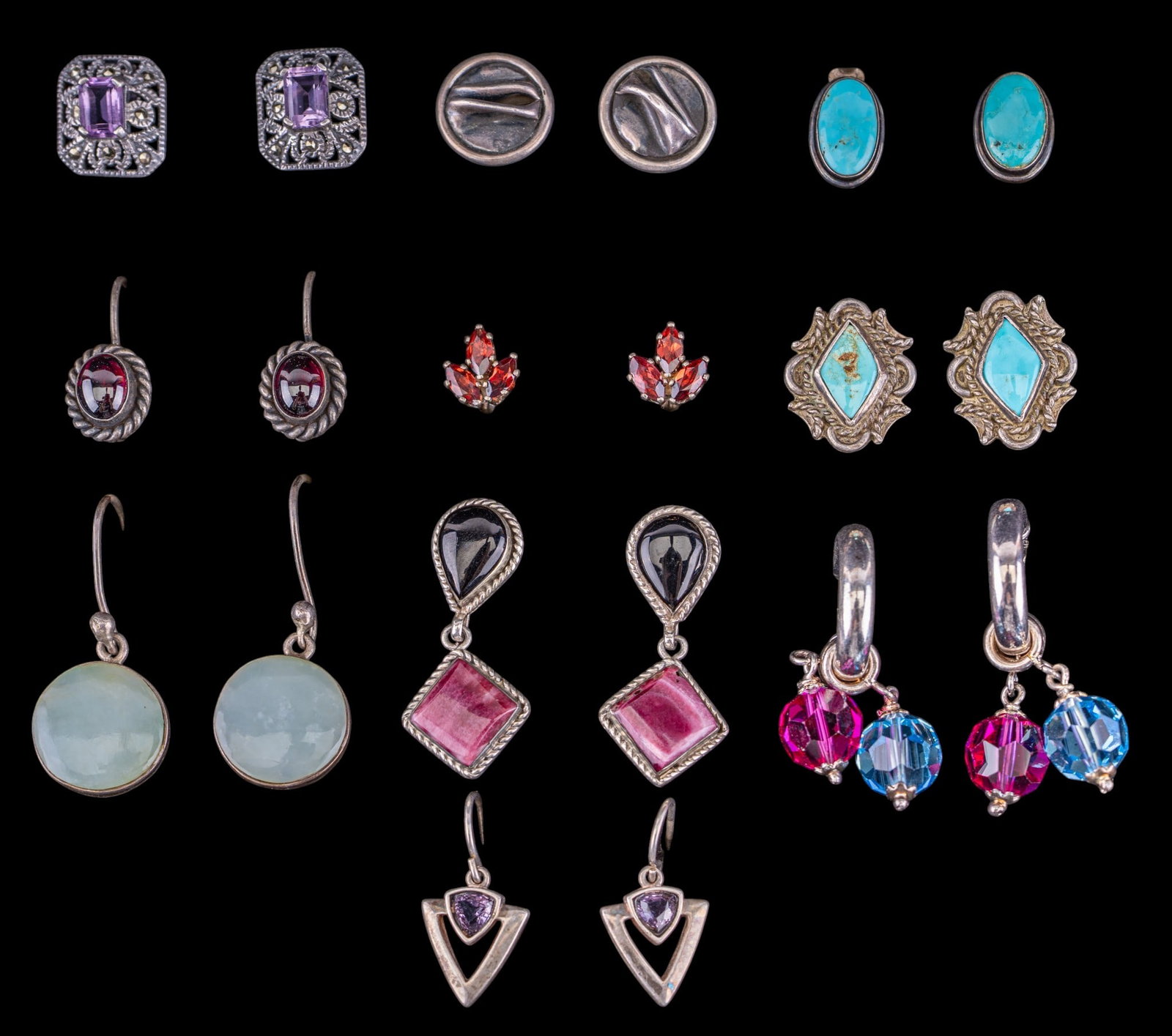 Vintage Artisan Sterling Earrings (10 prs): A collection of ten pairs of artisan crafted sterling earrings, some signed, featuring natural aquamarine cabochons, facet cut beads, amethysts, stone inlay, turquoise, and more. Total weight is appro
