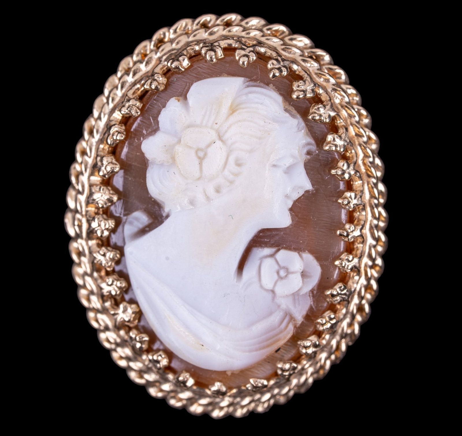 10K Gold Framed Cameo Pendant: A finely carved cameo portrait featuring a 10K gold frame, measures approx. 1" H, total weight is approx. 0.1oz.