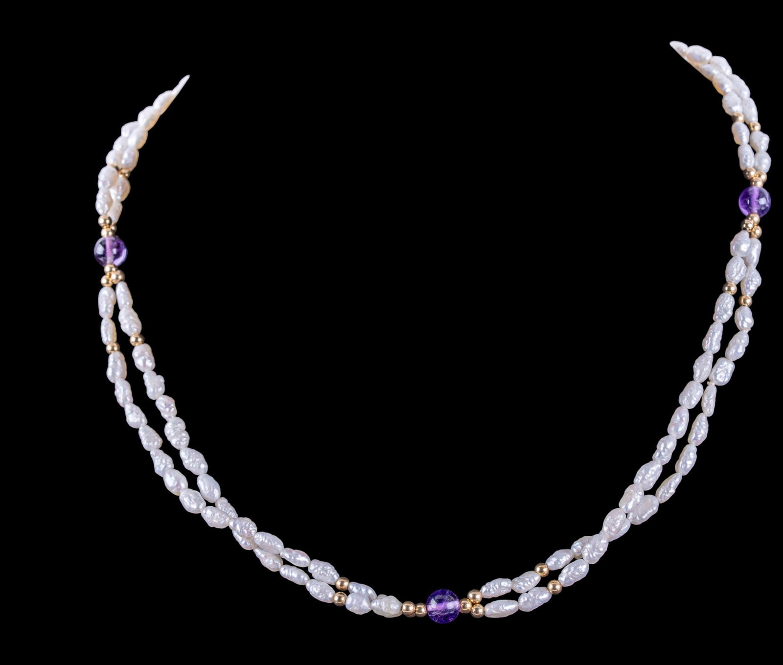 Freshwater and Amethyst Necklace, 14K Clasp: A multi strand freshwater pearl necklace featuring spherical amethyst beads, and 14K gold clasp and beads, measures approx. 9" on the drop, total weight is approx. 0.55oz.