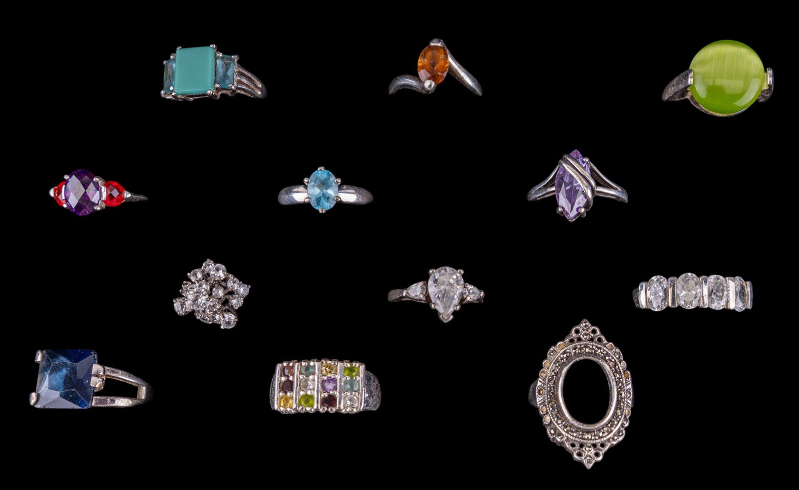 Sterling Silver Rings (12): A collection of 12 sterling silver rings featuring facet cut stones, sizes range from 7 to 9, total weight is approx. 1.9oz.