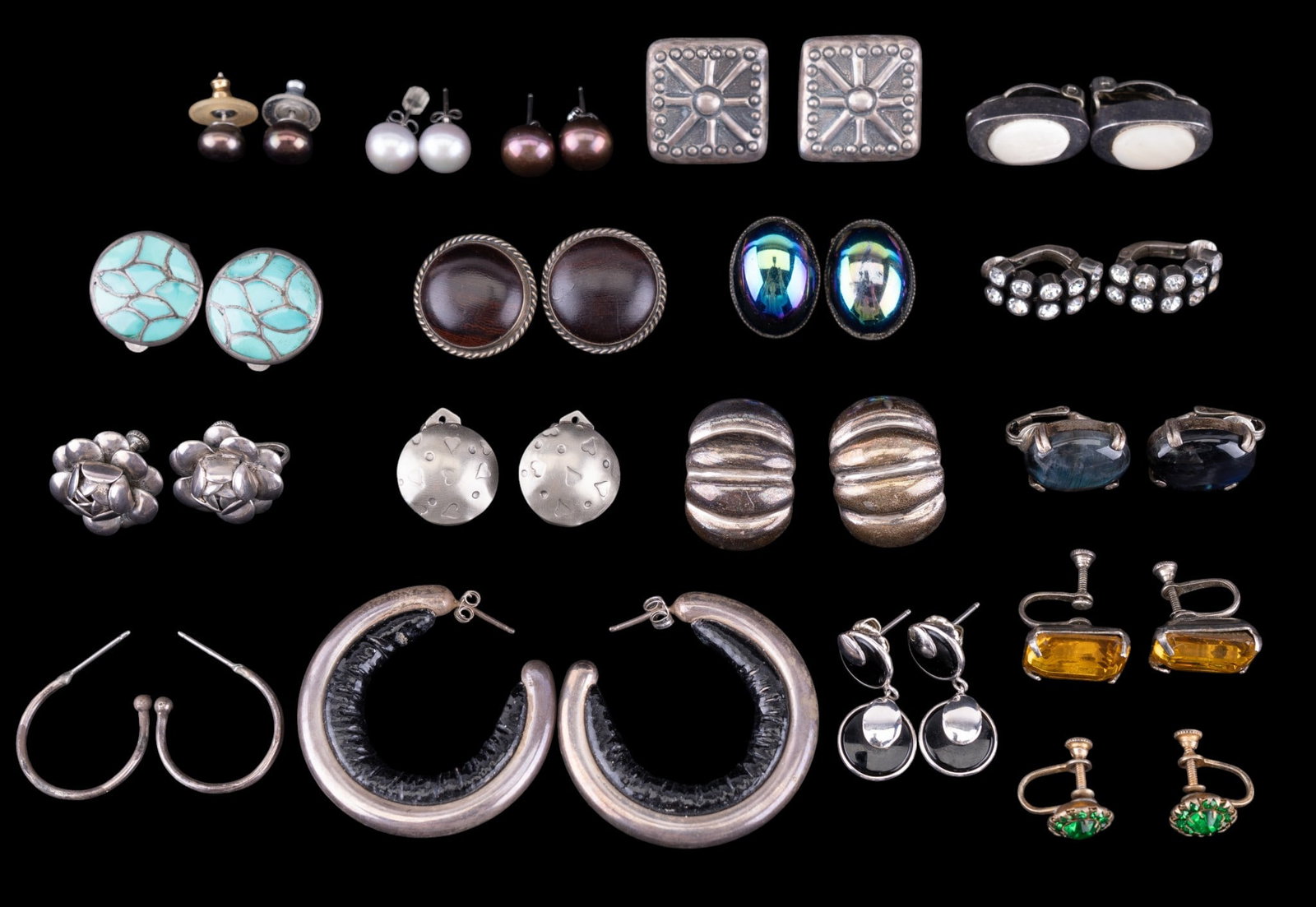Sterling Silver Earrings: A collection of 18 pairs of sterling silver clip on, screw back, and pierced earrings featuring turquoise inlay labradorite cabochons, freshwater pearls, and more. Total weight is approx. 4.35oz.