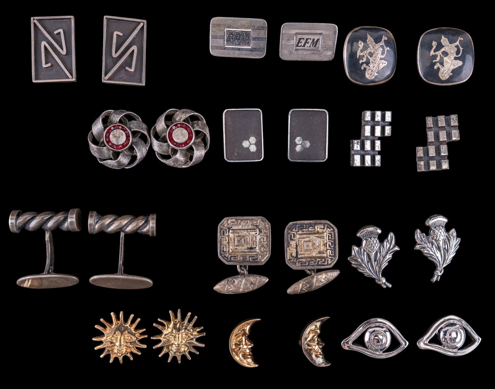 Sterling Silver Cufflinks: A collection of 12 pairs of vintage sterling silver cufflinks featuring Siam, celestial moon and star, monogrammed, and others. Total weight is approx. 4.3oz.