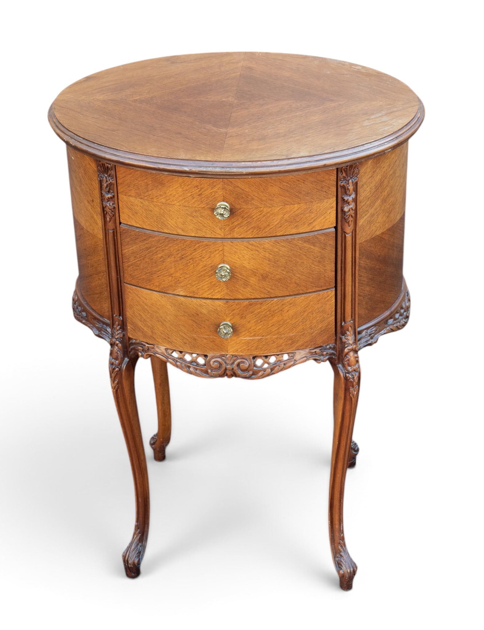 Louis XV Style Oval Accent Table: French Louis XV-style oval table featuring a rounded oval shape with 3 bow-front drawers, each with ornate brass pulls. Measures approx. 29.5" H x 20.5" W x 15.5" D.