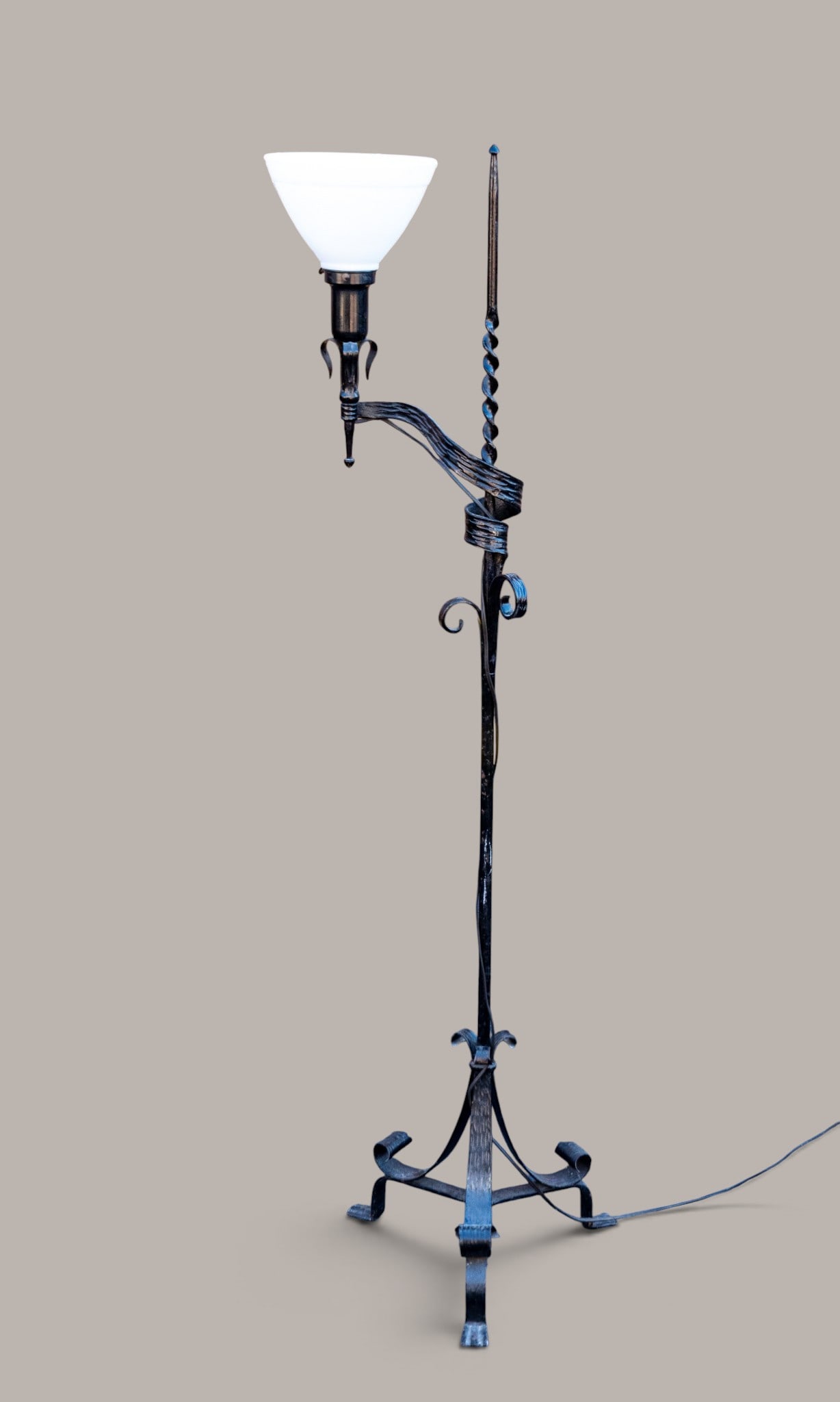 Gothic Revival-Style Wrought Iron Floor Lamp: Gothic-revival style wrought iron floor lamp with a single socket. Features twisted metal column design. Measures approx. 55.5" H.