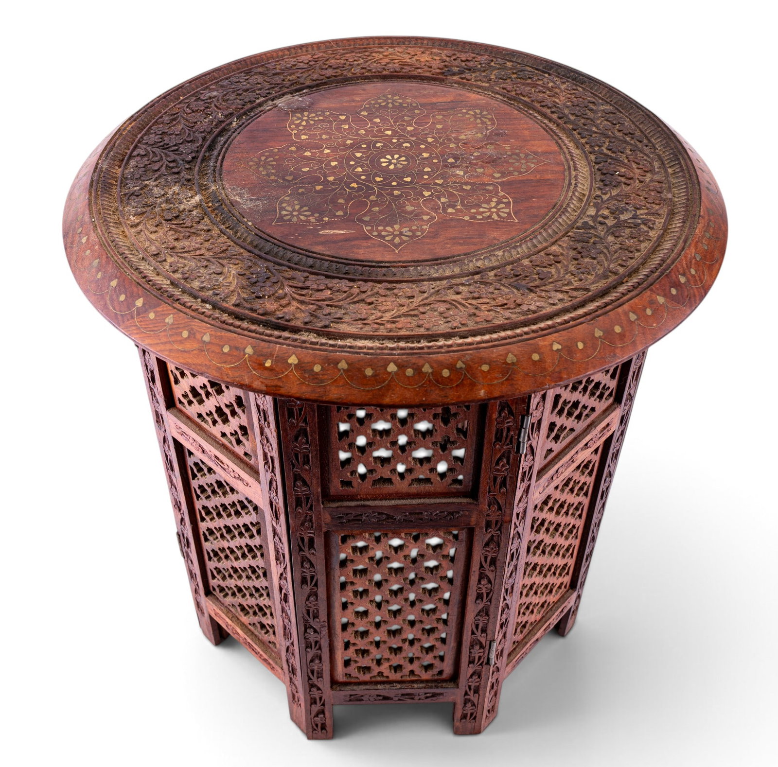 Vintage Anglo Indian Inlaid Stand, 2 pcs: Vintage Anglo Indian Brass Inlaid Travel Table, measuring approx 19 h x 21 diam. as standing. Comes in two pieces and the base and is hinged to lay semi-flat.