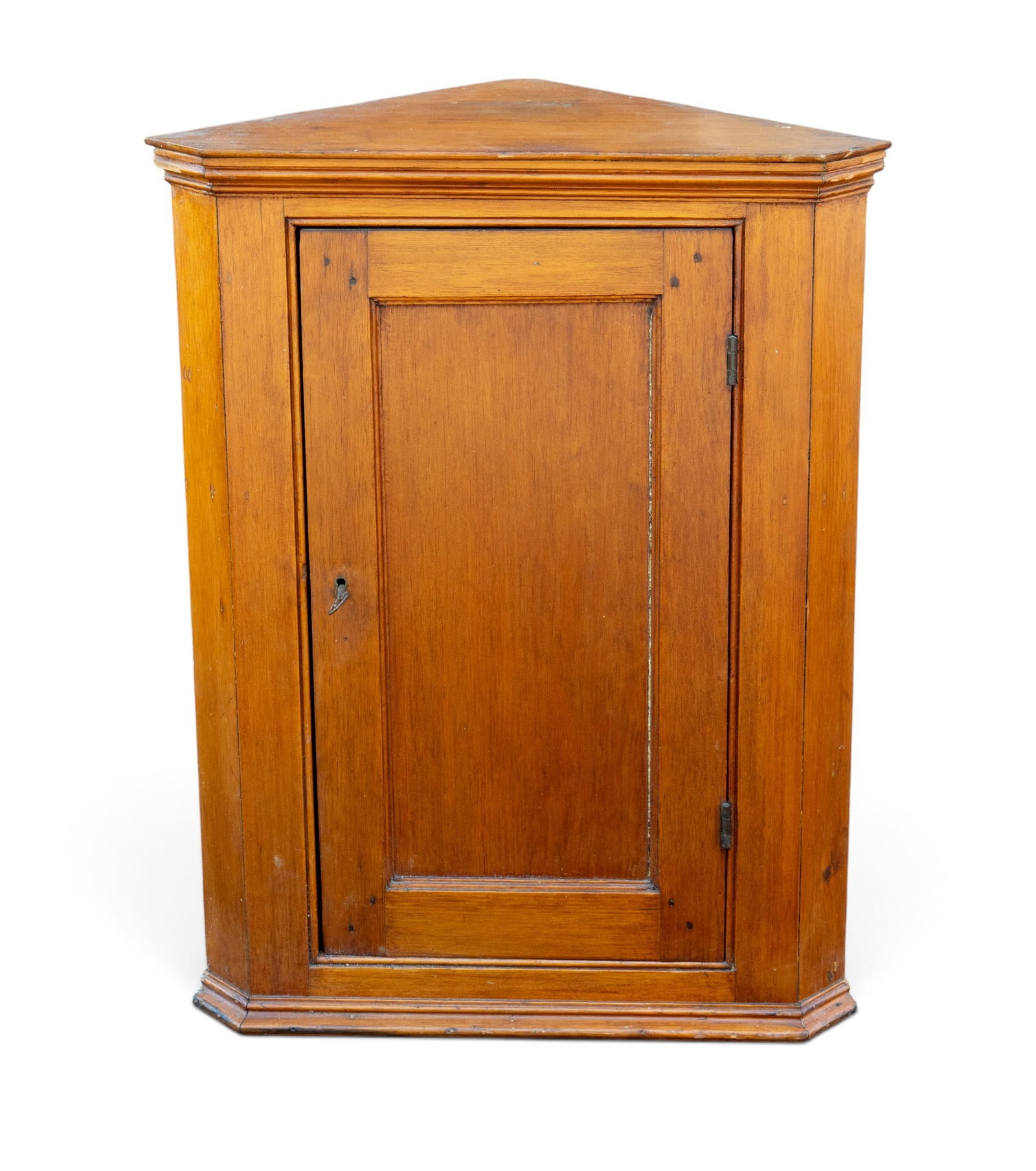 Early 19C Hanging Corner Cabinet: Early 19th century dominative hanging corner cabinet with dovetailed joinery. Includes original lock and key. Measures approx. 30" H x 23.25" W x 12.5" D.