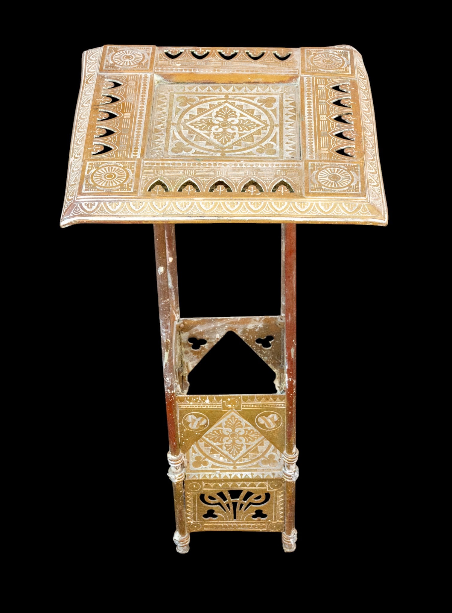 Southeast Asian Embossed Square Pedestal Table: Southeast Asian embossed square pedestal table constructed of brass. Some bending to corners as seen in photography. Measures approx. 26" H x 13.25" Square.