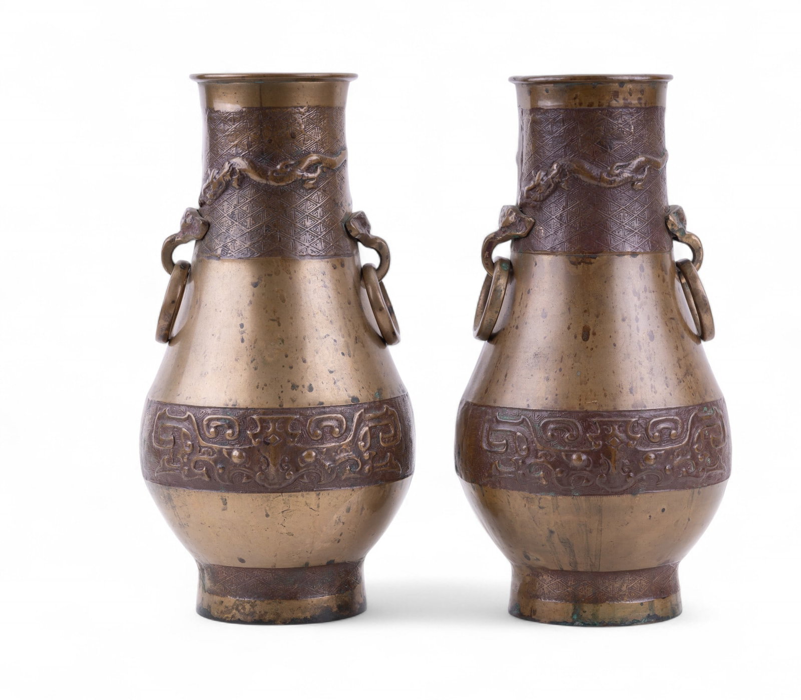 2 Korean Bronze Double Handle Relief Vases: A matching pair of early Korean bronze vases with double ring handles and dragon/lizard motif. Marked "South Korea" on bottoms. Items measure approx. 11.5" high each.