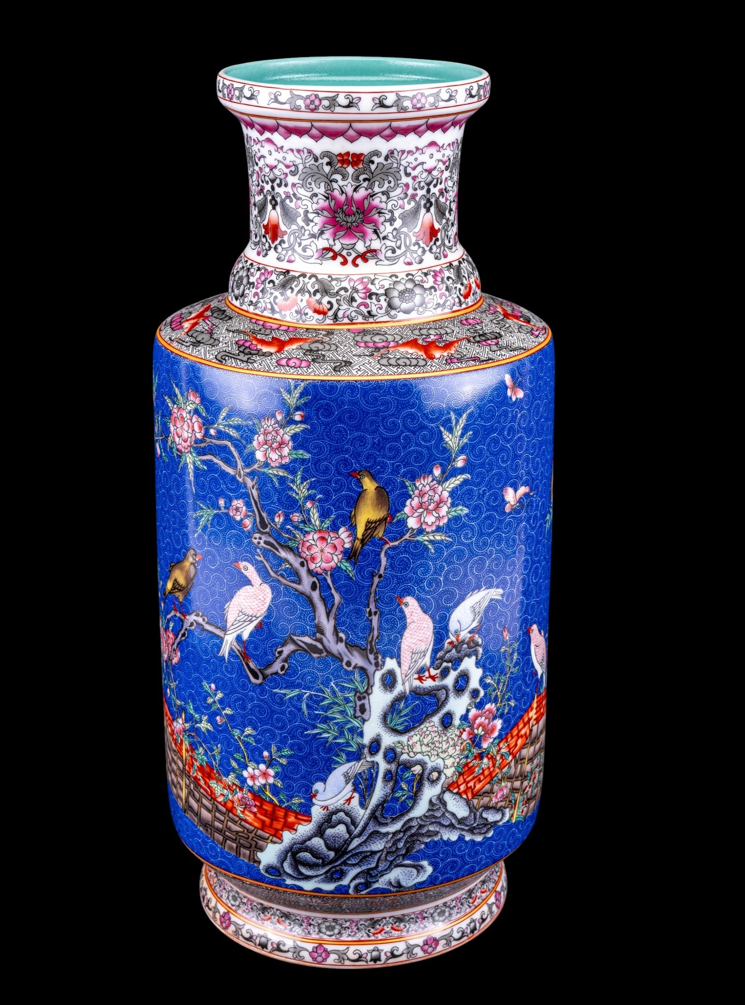 Chinese Porcelain Mallet Vase: Chinese 20th century porcelain mallet vase featuring a blue ground with intricate sgraffito etching and decorated with birds and flowers in the famille rose palette. Interior and underside in turquois