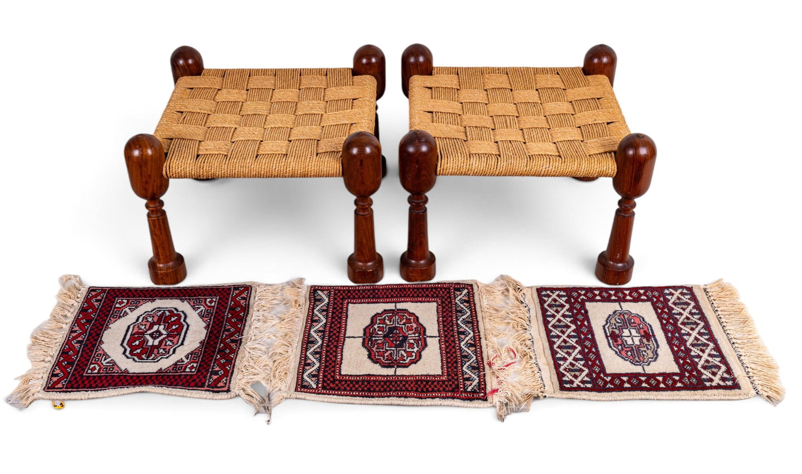 Persian Rosewood Stool Pair w/ Persian Mats: A pair of Persian Rosewood stools, hand-woven and in very good condition. Each measures approx. 18"Lx18"Wx14"H. Also comes with three Persian mats in various designs, each measuring approx. 18"Lx12.5"