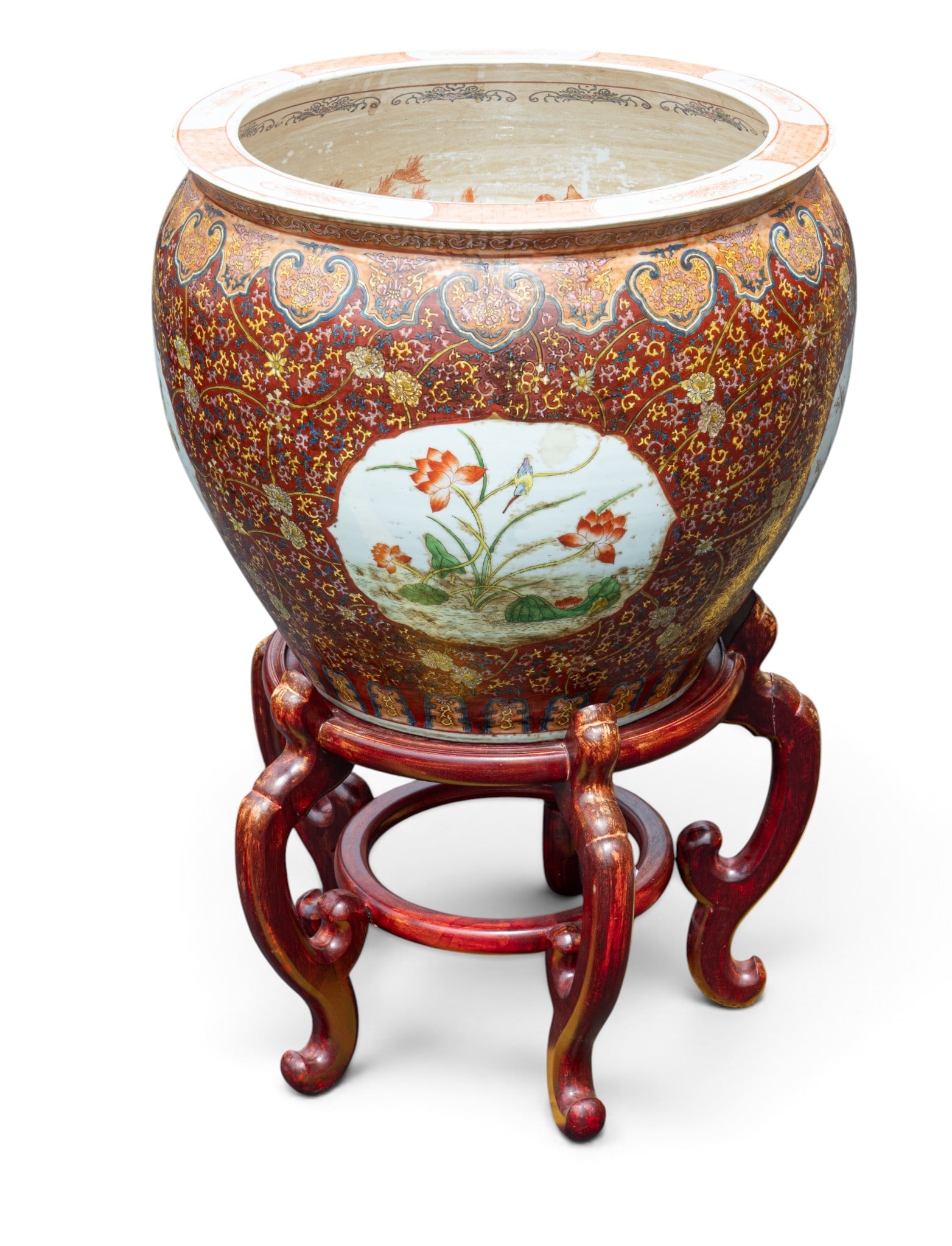 Vintage Famille Rose Koi Planter with Stand: A vintage Fallie Rose decorated porcelain koi planter pot, approx. 22" diam x 18.5" H and an accompanying wooden stand, approx. 20" W x 16" H.