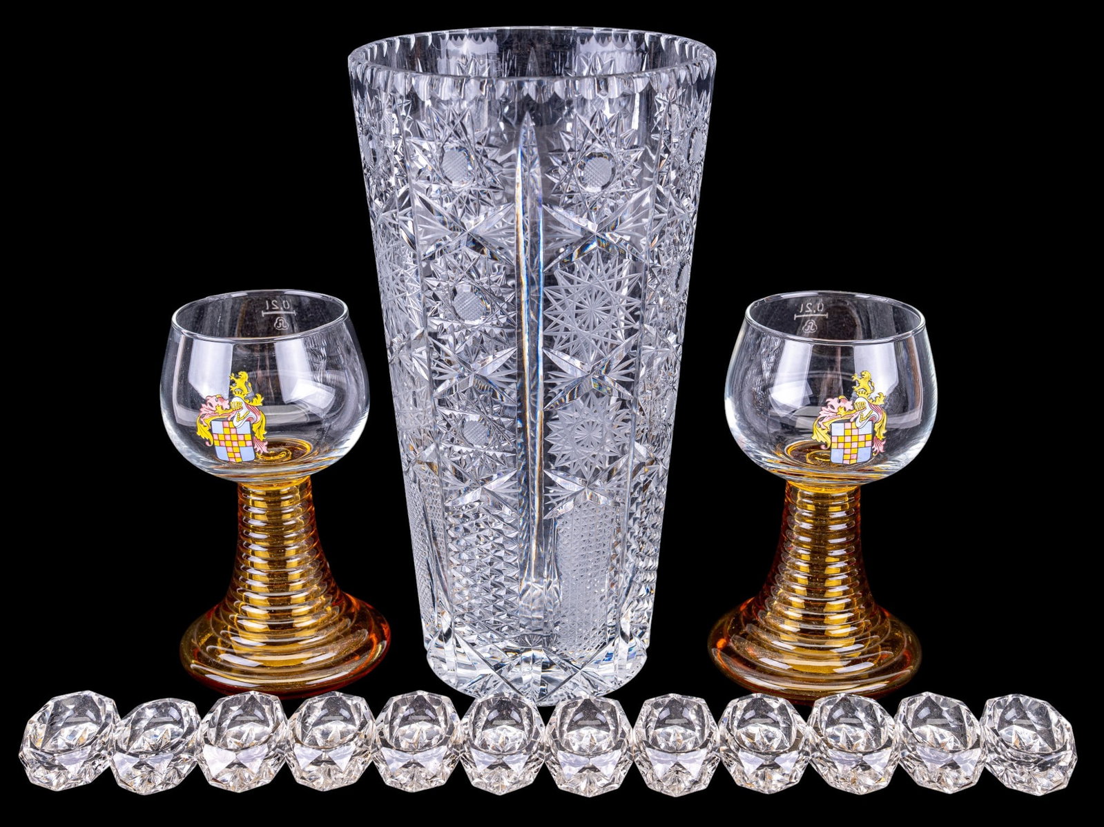 Bohemian Crystal and Glassware: A Bohemian Czech (possibly Yugoslavia) crystal vase featuring the 'Queen Lace' pattern cut, measures approx. 10" H, a set of 12 cut class salt cellars with faded paint designs, note some edge loss, an