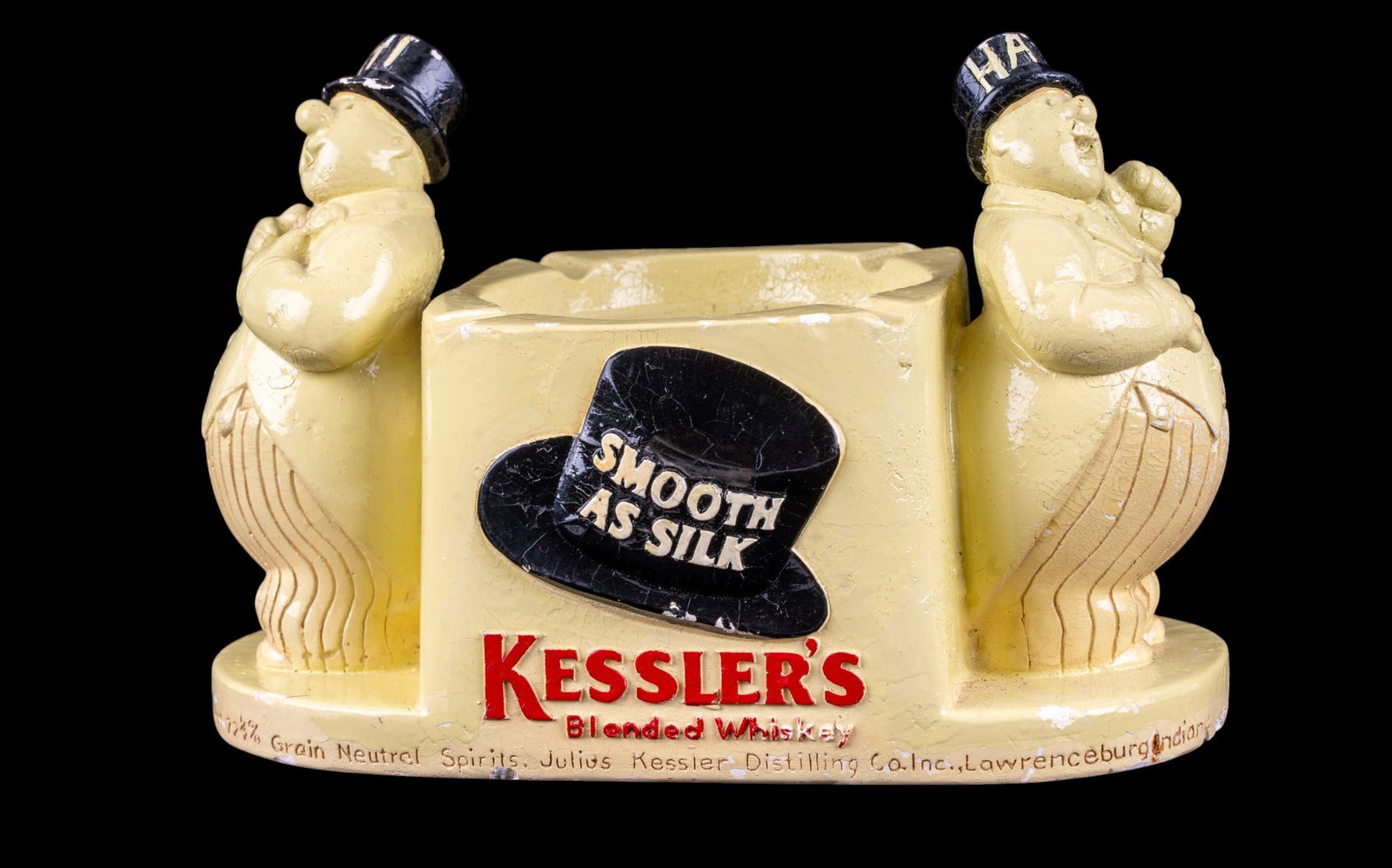 Vintage Kessler's Chalkware Ashtray/Bottle Holder: Kessler's Blended Whiskey advertising display, circa 1940s. "Hi & Hatt" collectible Mold No. 20553. "Smooth as Silk" slogan on a top hat graphic on both front and back of three-dimensional piece. Feat