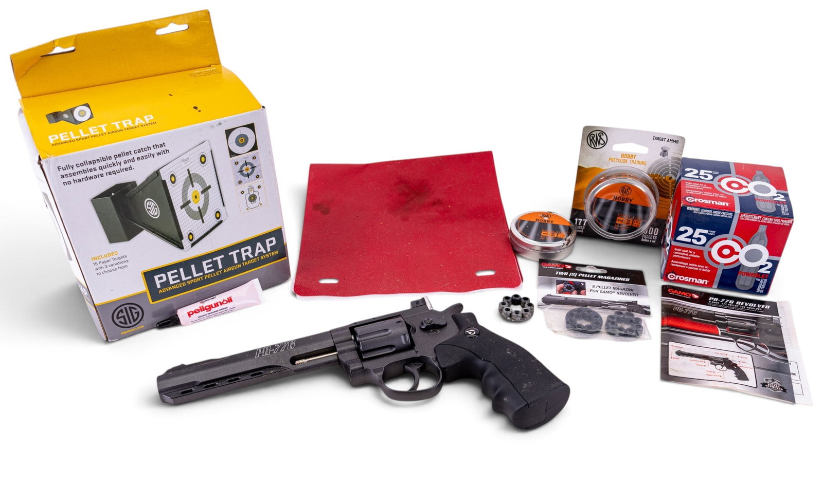 Gamo PR-776 8 Shot Pellet Revolver & Accessories: Gamo PR-776 8 Shot Pellet Revolver along with accessories including a Sig Sauer collapsible metal pellet trap with paper target (boxed), two tines of RWS Hobby .177 pellets (one sealed in cardboard), 