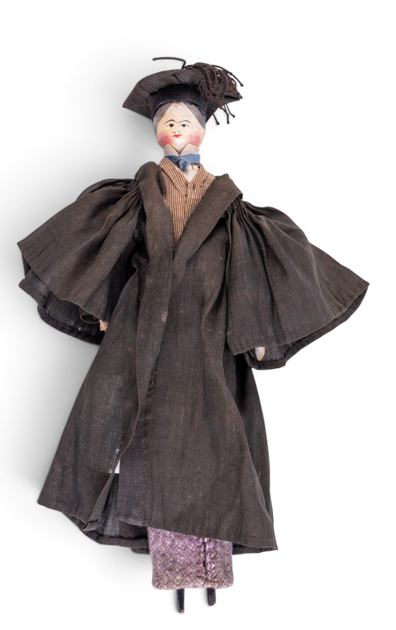 Antique Grodnertal Peg Doll: An antique Dutch Grodnertal hand painted wooden peg doll featuring a college scholar outfit and robe. Measures approx. 10" H.