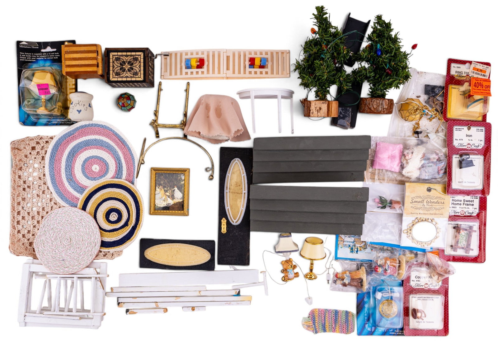 Dollhouse Builing Accessories: An assortment of dollhouse building and interior accessories, some new in packaging, featuring lamps, rugs, window and door frames, a butcher's block, flower arrangments, Christmas trees, and more.