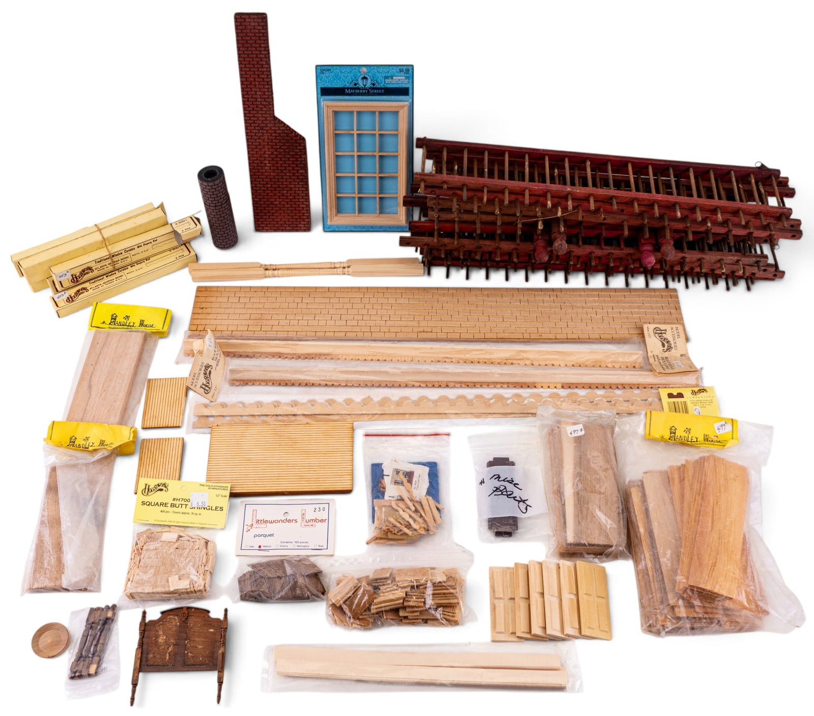 Houseworks LTD & Other Dollhouse Supplies: An assortment of unfinished dollhouse decorating and building supplies by Houseworks LTD, HaHandley House, a vintage dollhouse fence, and more.