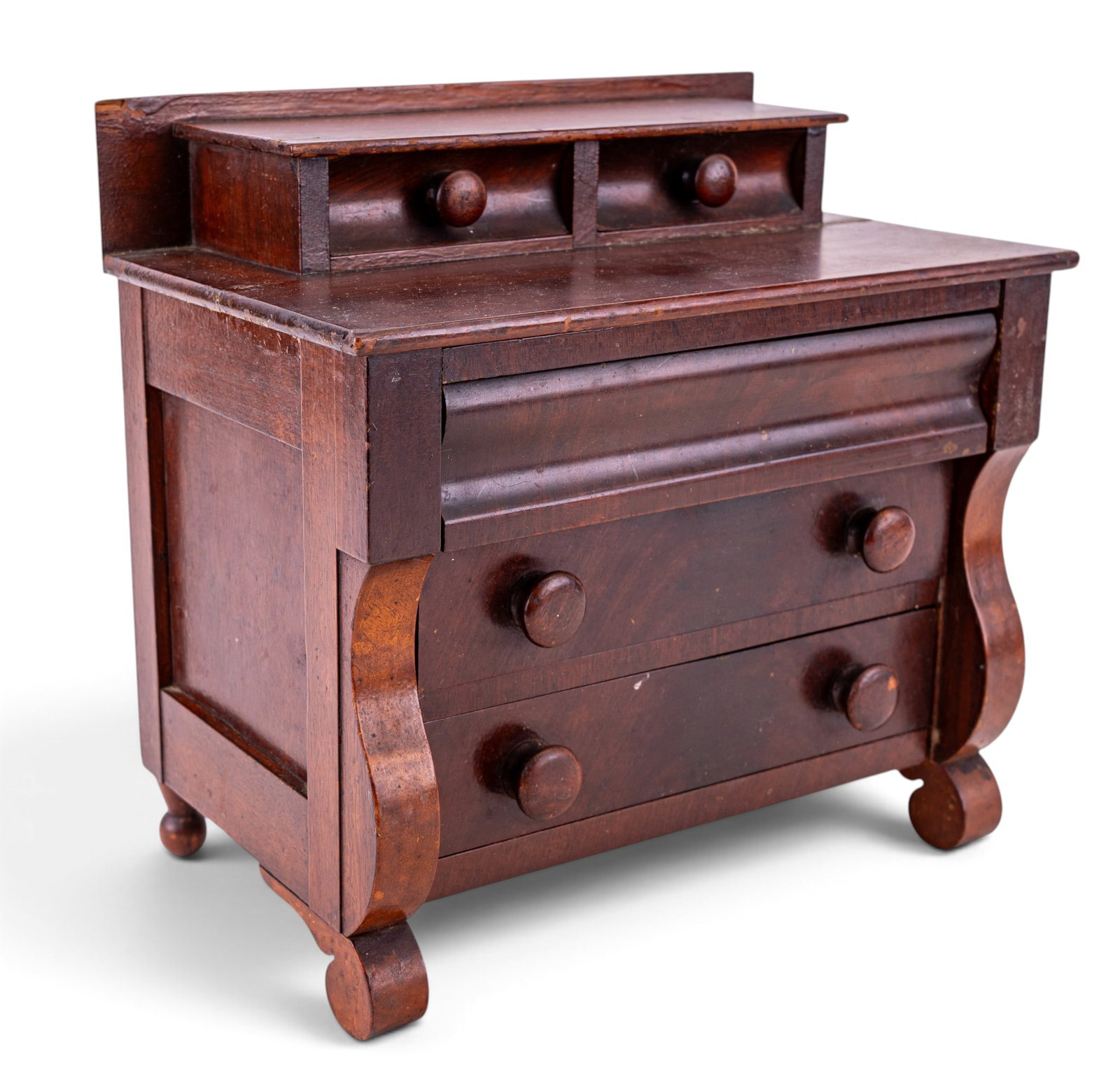 19/20th C Empire Style Salesman Sample Dresser: A 19/20th C Empire style salesman sample 1/3 scale dark wood dresser, measures approx. 9.5" W x 6" D x 9" H. Note some loss and and a crack in the surface of the wood.