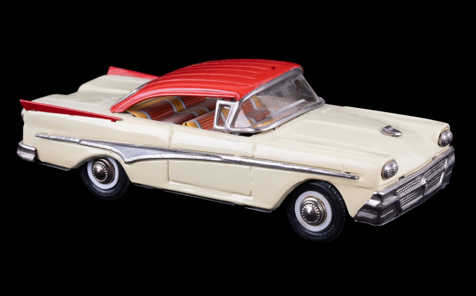 Joustra Serie Cadet 1958 Ford 2Door Tin Toy in Box: Produced in France by Joustra, this vintage miniature car is in good working condition and comes in its original box. 1958 Ford 2 door sedan tinplate friction toy in a vibrant two-tone color scheme of