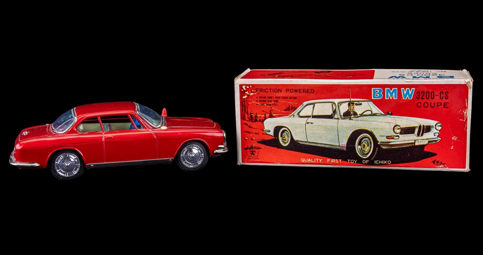 Ichiko 1960s BMW Coupe Tin Toy in Original Box: Friction powered tinplate toy car made in Japan by Ichiko. This 1960s BMW 3200 CS 2 door coupe model is in a flashy red color. Features trunk and hood that both open and shut. The hood, or bonnet, pop