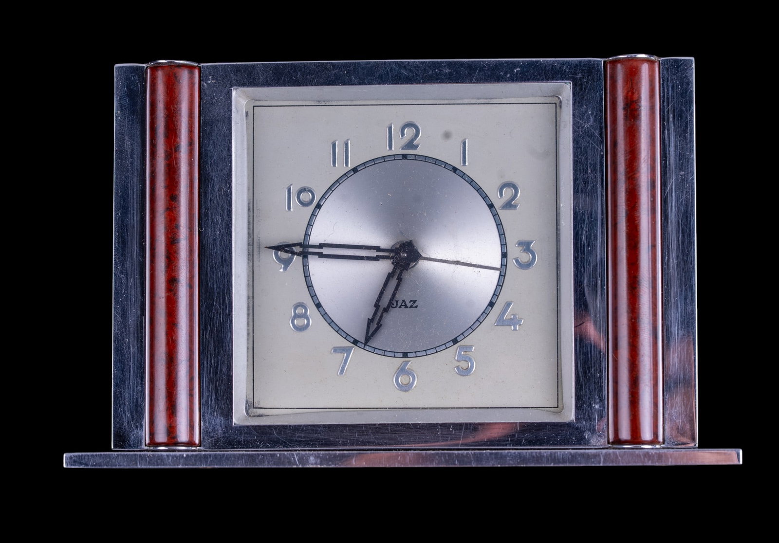 Jaz France 1930s Art Deco Chrome Clock w/ Bakelite: Vintage art deco mantle clock made by Jaz in France, likely in the 1930s. Design features distinct chrome-plated metal foundation with a mirrored surface, paired with Bakelite wood style pillars. Anal