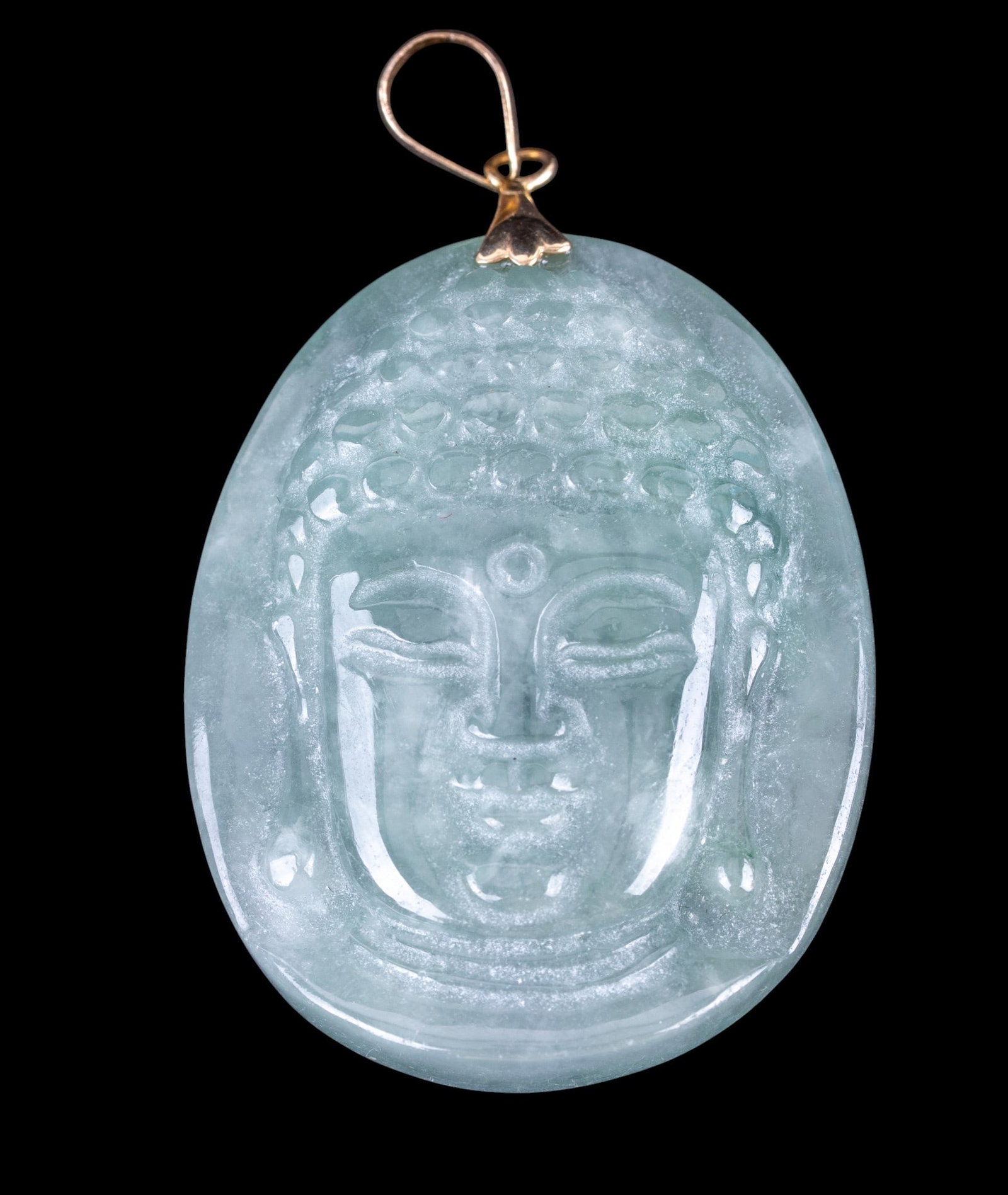 14K and Jade Buddha Pendant: Jade pendant, carved with Buddha detail and 14K bale.