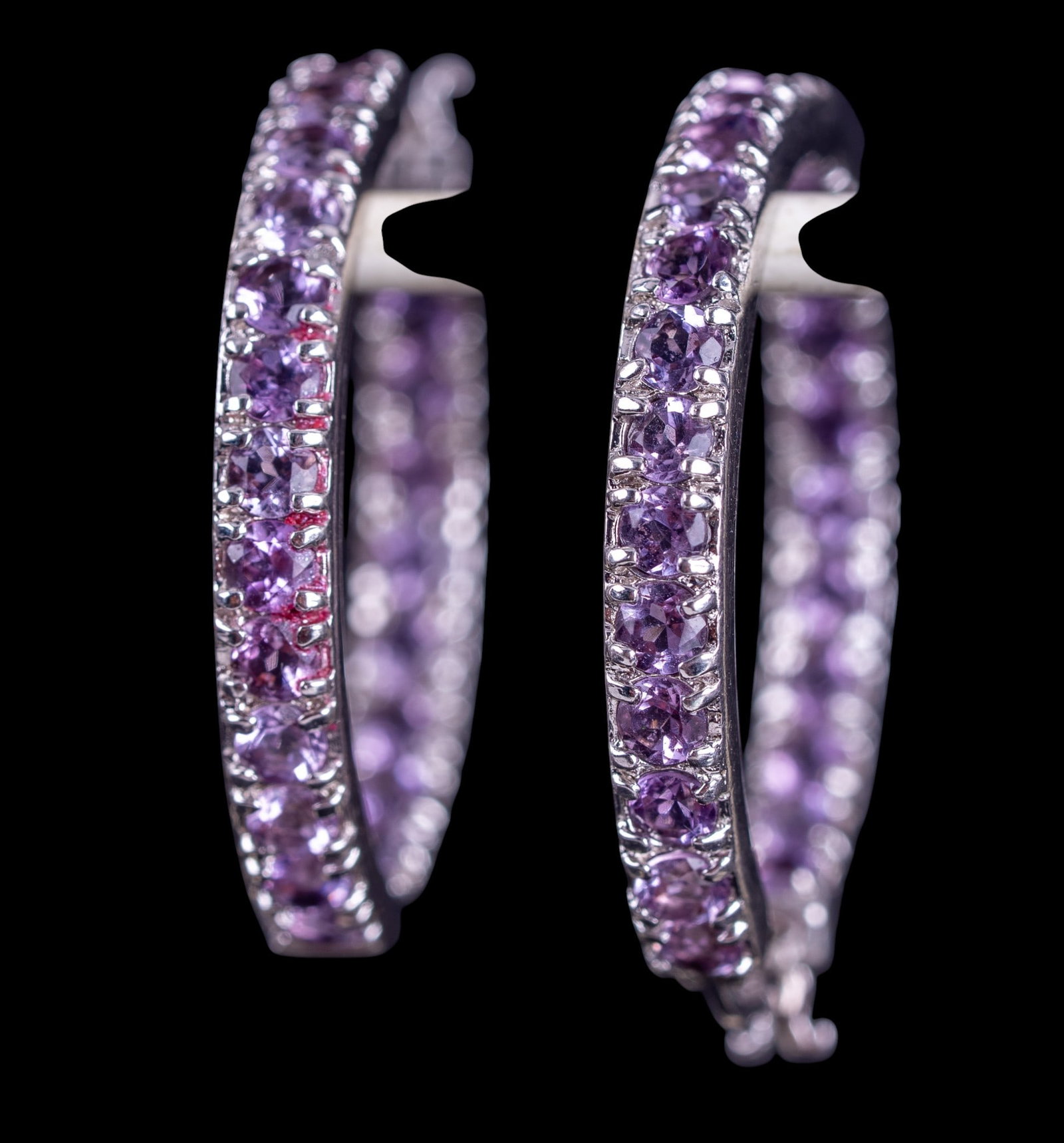 Amethyst and Sterling Inside/Out Hoops: Inside/Out 0.925 sterling silver hoop earrings set with amethyst stones.
