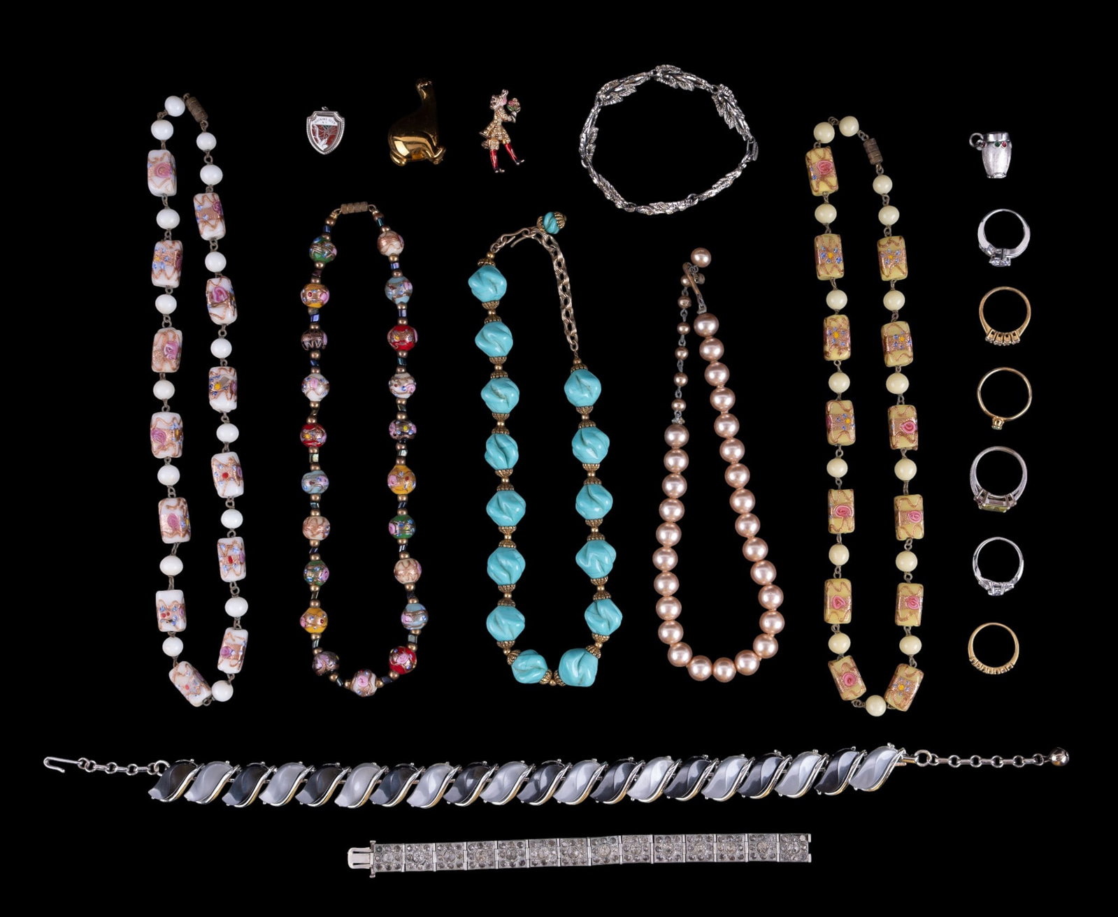 Art Deco Glass Necklaces and More: Three glass necklaces, Lucite necklace, pot metal bracelet, pins, and more.