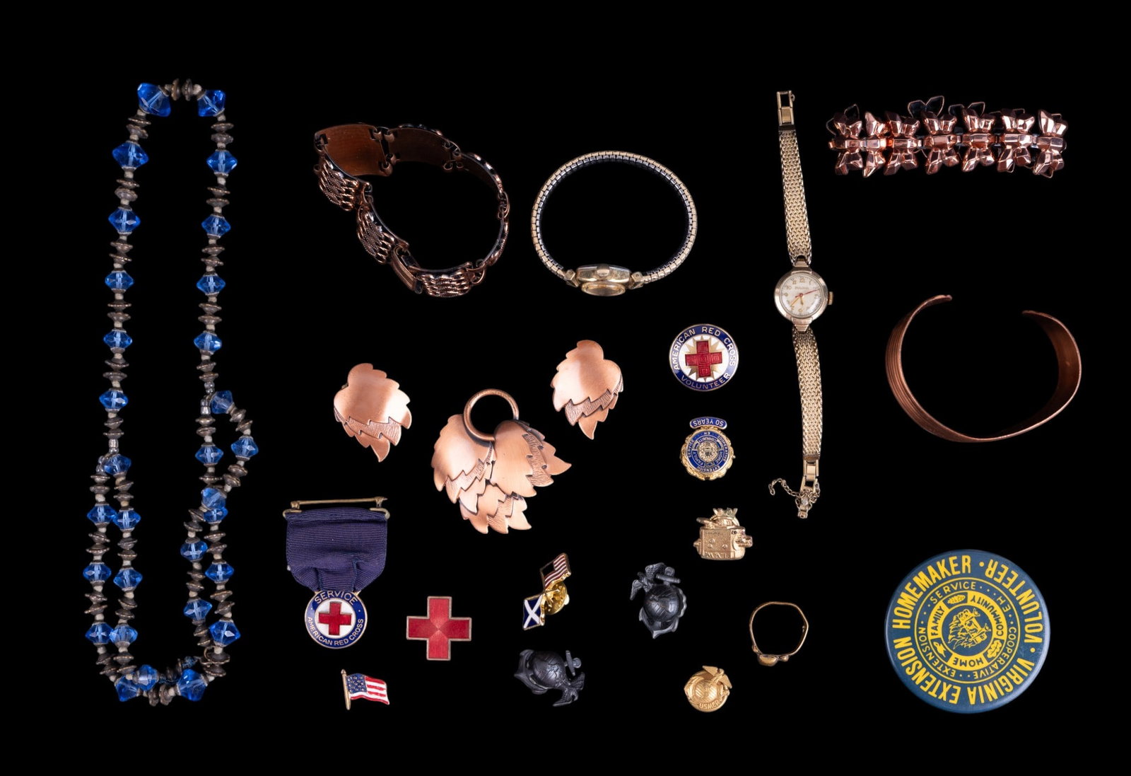 Art Deco Necklace and Copper Jewelry: Includes a blue glass early necklace, 5 pieces of vintage copper jewelry including Renoir, antique skull ring, Bulova and Unichron watches, and a selection of emblems.