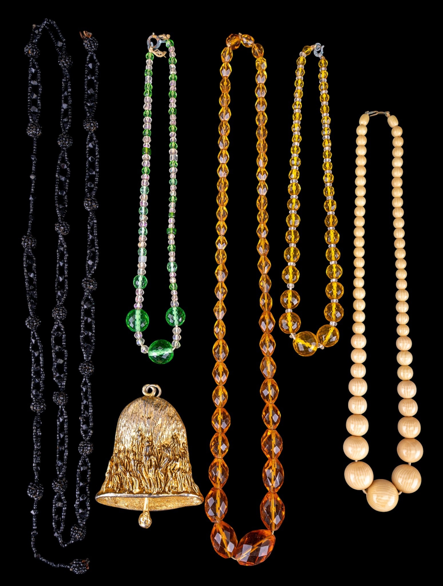 Vintage Jewelry: Three early vintage glass necklaces, Victorian black bead necklace, and a large 1970's Liberty Bell pendant.