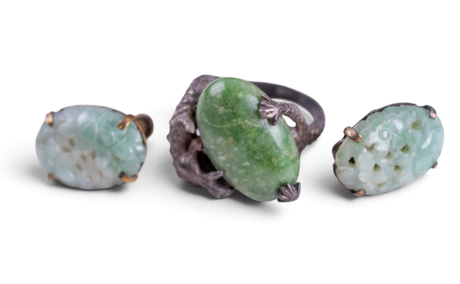 Vintage Jade and Sterling Jewelry: Sterling and carved jade earrings, and a substantial sterling jade ring with dragon detail.