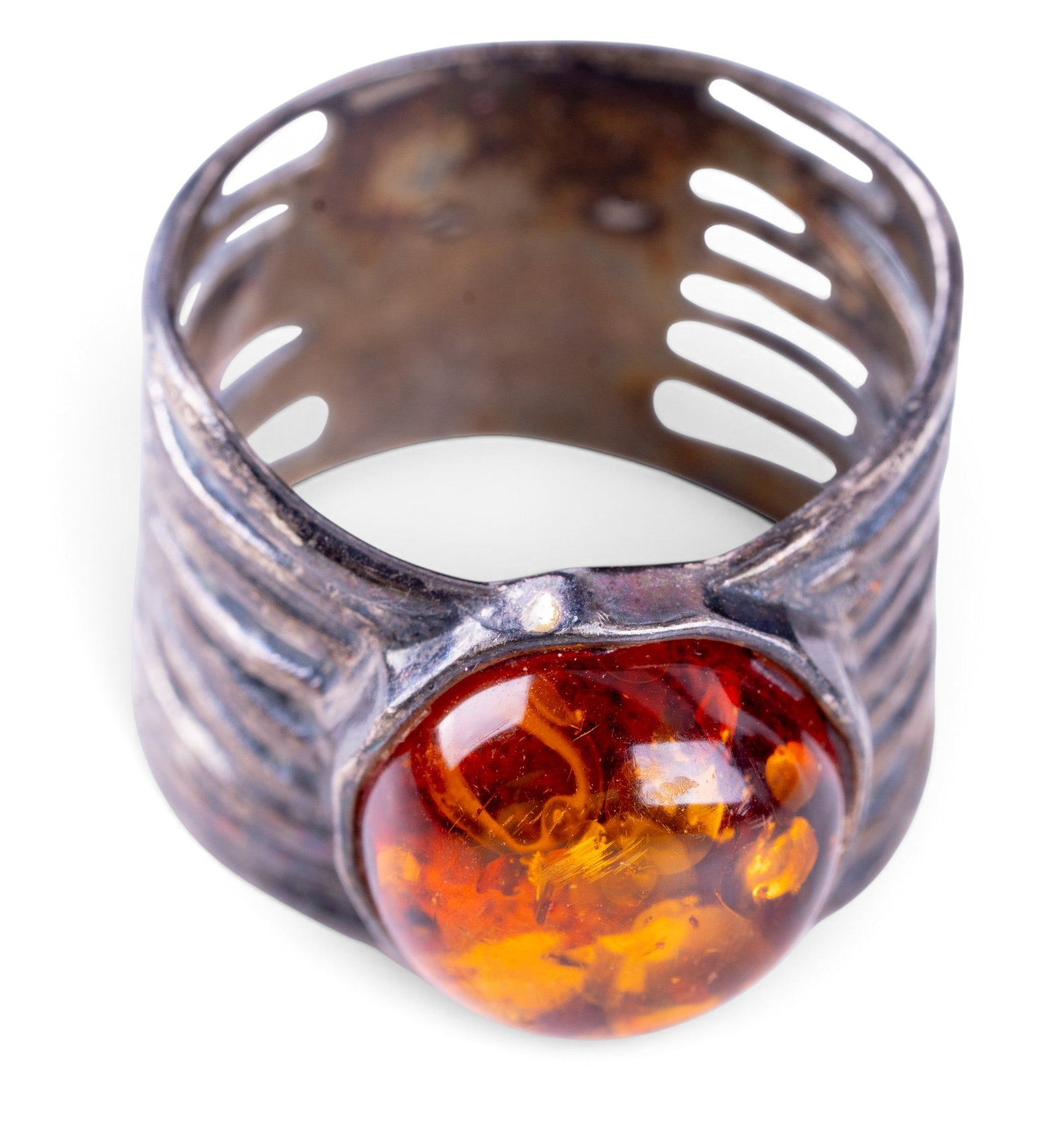 Amber and Sterling Silver Ring: Wide band style sterling silver ring set with amber.