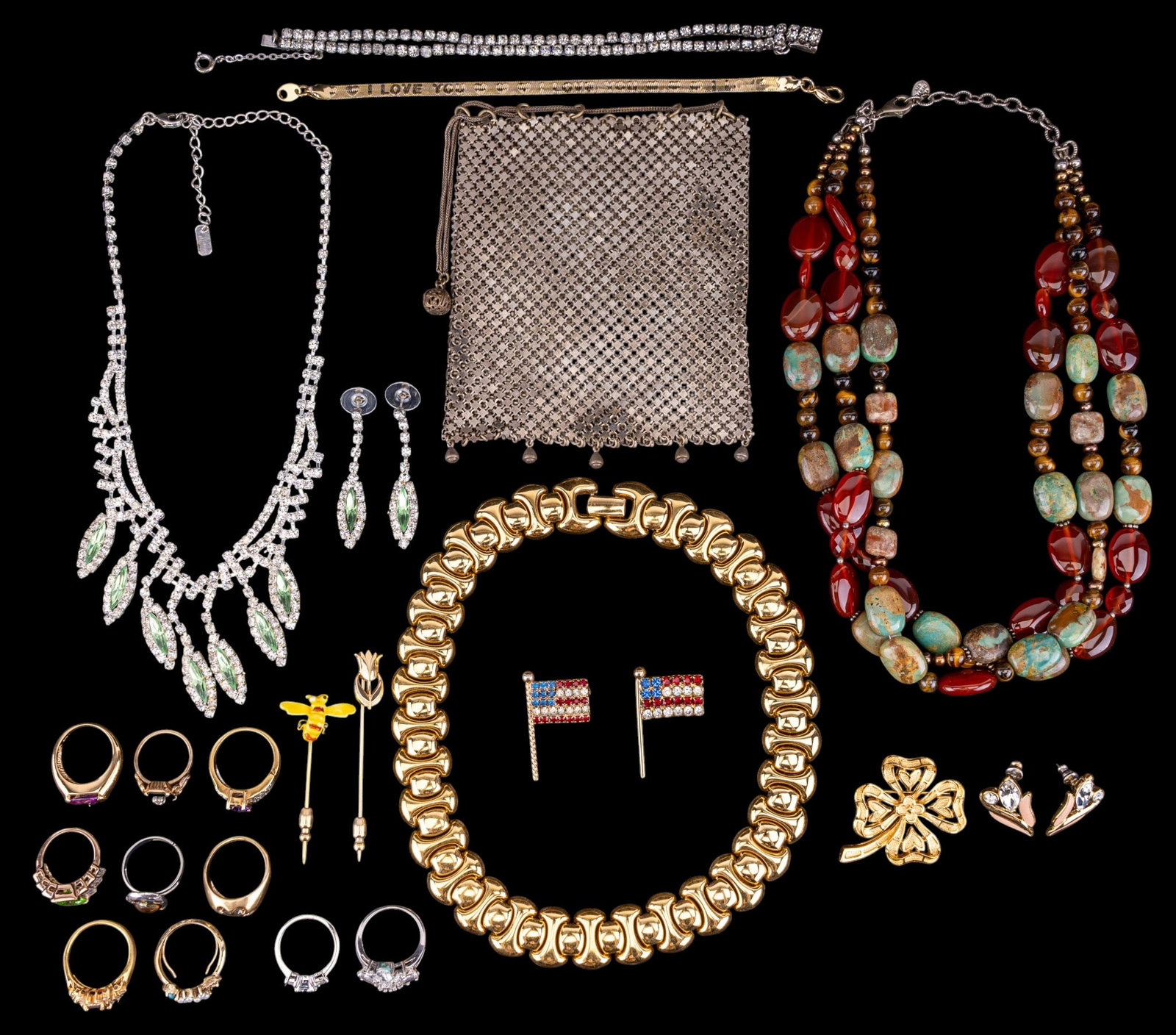 Trifari and Other Costume Jewelry: A collection of costume jewelry including earrings and necklace by Trifari, a stone and glass multi strand necklace with sterling clasp, vintage clear and green rhinestone necklace and earring set,