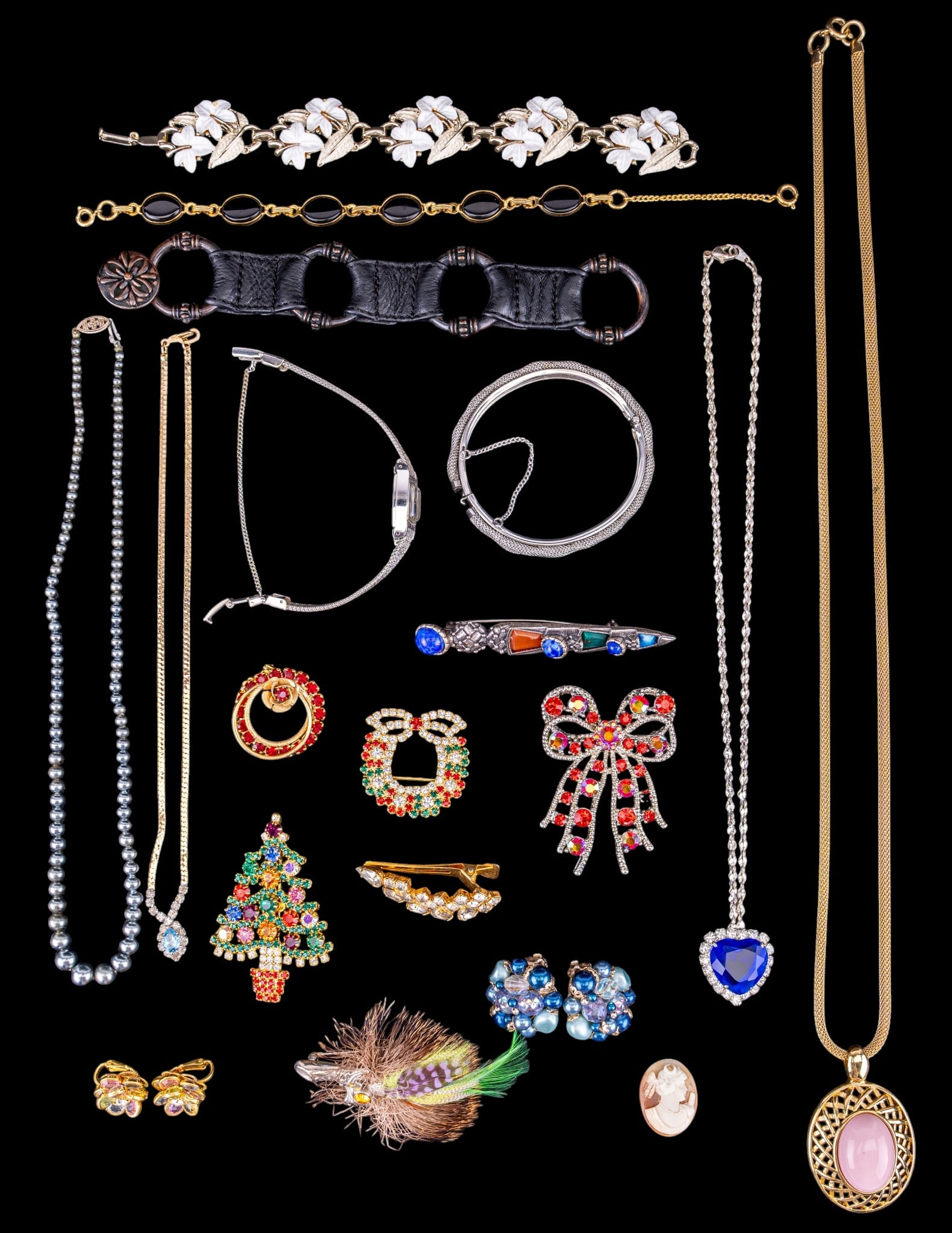 Seiko Ladies Watch and Other Jewelry: A Seiko silver tone ladies wrist watch with a blue dial #010258, vintage rhinestone brooches, gold tone and pink lucite necklace by Trifari, cut rhinestone necklaces, and more.