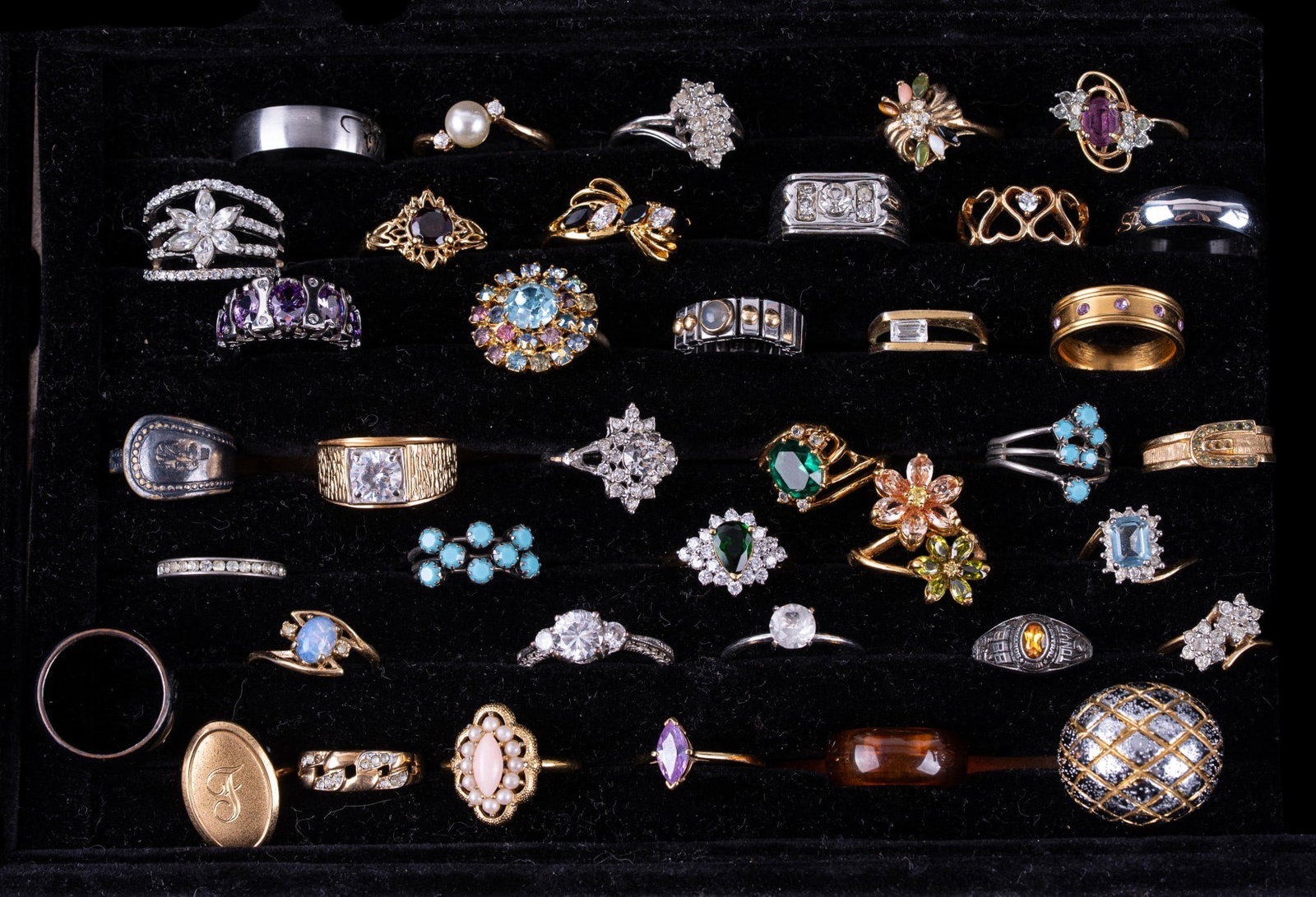 Vintage Cocktail and Other Rings (39): A collection of 39 costume and cocktail rings including facet cut stone, faux pearls, enamel, styles such as a class ring, men's rings, cigar band rings, and more. Sizes range from 5.5 to 11.