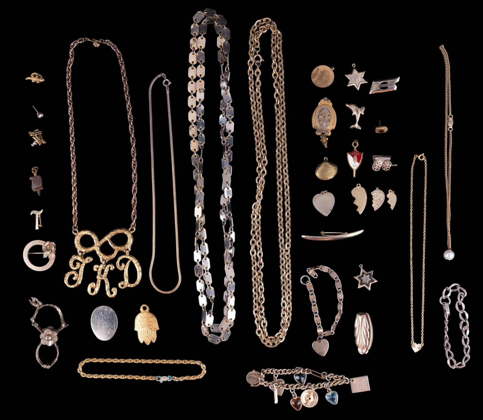 Gold Filled and Gold Toned Jewelry: A collection of gold filled and gold toned jewelry including gold tone opera length chains, vintage charm bracelet, will require new clasp, heart shaped, star of David, and other pendants, Victorian g