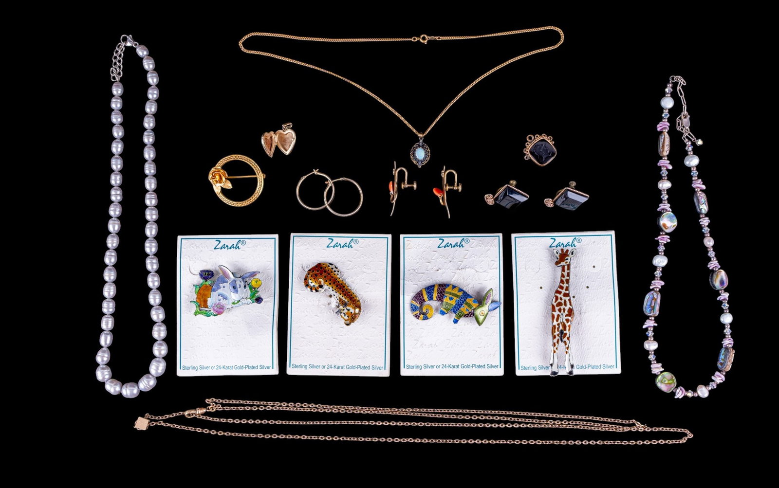 Sterling and Gold Filled Jewelry: A collection of sterling and gold filled jewelry featuring a Victorian Intaglio pendant, gold filled brooches, screwback earrings, locket, and more, Zarah sterling and enamel brooches, a cultured pear
