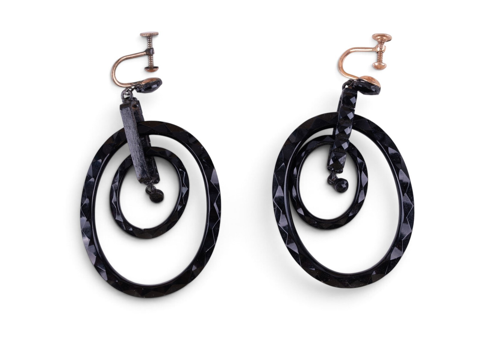 Vintage Onyx and 10K Gold Earrings: A vintage pair of carved onyx double loop earrings featuring 10K gold screw back fastenings.