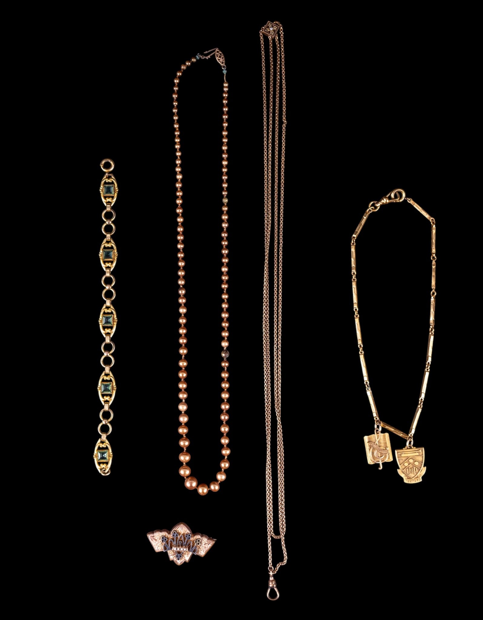 Victorian Gold Filled Jewelry: A graduated faux pearl necklace with 10K gold fish hook clasp, and a collection of Victorian gold filled jewelry including a bracelet with facet cut green stones, an etched brooch with seed pearls, a 