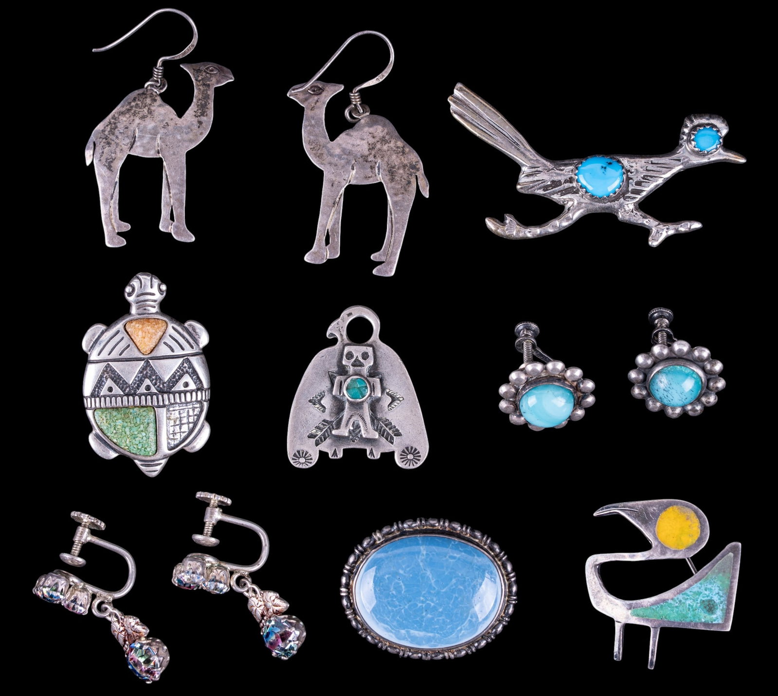 Vintage Artisan Sterling Jewelry: A collection of vintage artisan sterling jewelry including an English blue glazed porcelain brooch, camel earrings, Czech iris glass screw back earrings, Peruvian inlay brooch, turquoise cabochon road