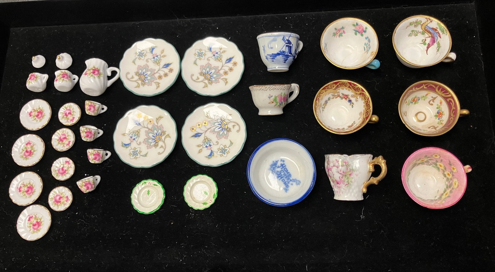 Dollhouse Miniatures Porcelains / Tea Cups: Five Staffordshire marked and painted porcelain miniature teacups approx 1" dia various patterns, a Delft and Japan tea cup similar size, 4 Noritake bone china floral decorated with green rim plates a