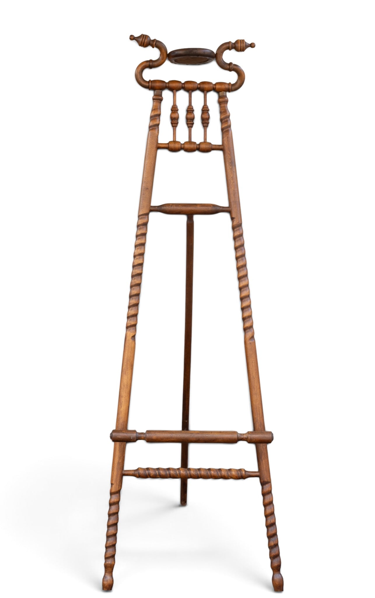 Antique Victorian Carved Wood Easel: Antique Victorian-era carved wooden artist's easel featuring spiral turned elements, and decorative upper crest with small central mirror. Measures approx. 68" H x 60" Standing Height x 19" W x 36" D 