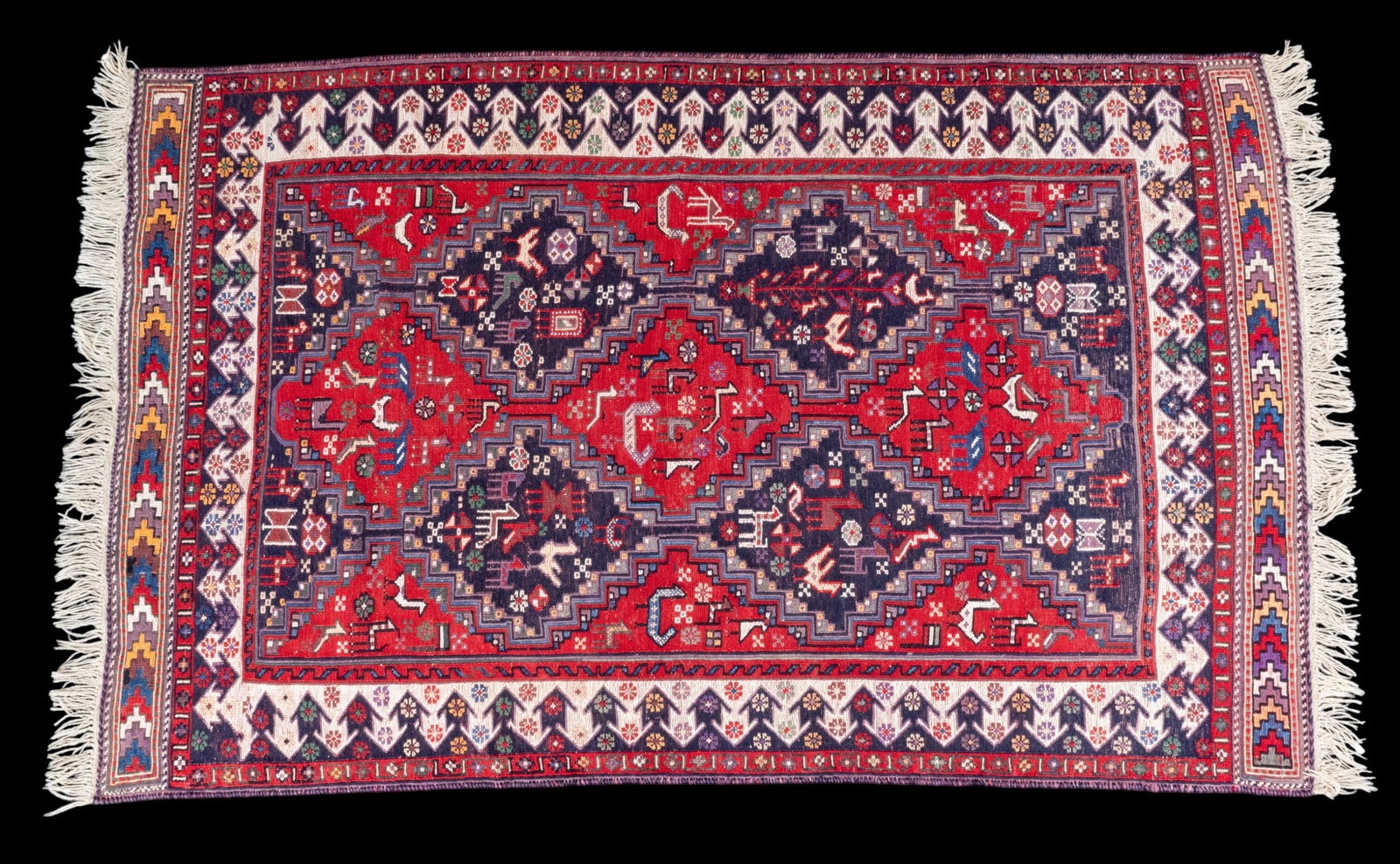 Figural Sumak Area Rug: Very colorful, figural with animals Sumak area rug. Measures approx. 7' x 4'5". Colors red, blue, yellow, white.