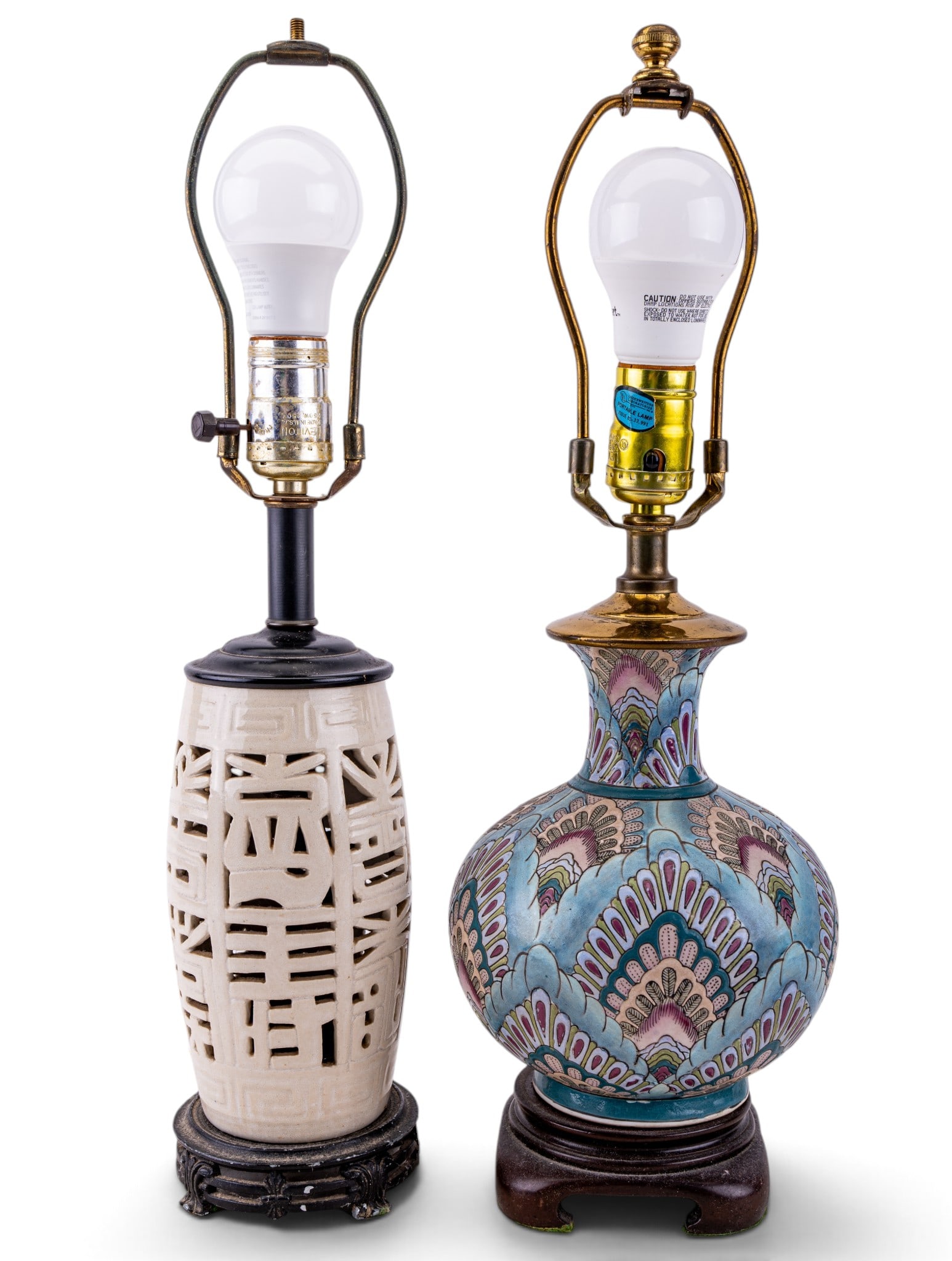 Boho Peacock/White Reticulated Ceramic Table Lamps: Mismatched pair of vintage ceramic table lamps. One with a boho peacock motif, another in a white reticulated design. Similar silhouettes and heights, both feature built-in harps, functional sockets a