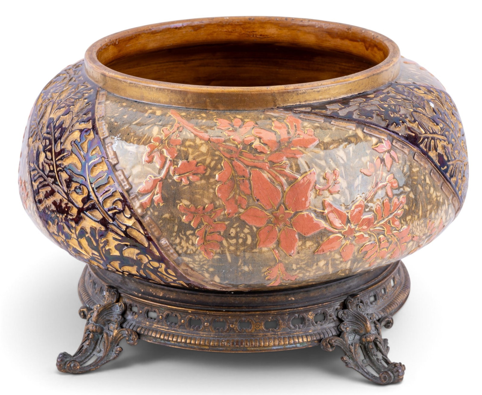 19th C Majolica Planter Pot on Bronze: Majolica planter, or cachepot, featuring heavily sculpted high relief design. Vessel rests on four ornate feet. Very good condition. Some scuffs, crazing. Measures approx. 15"Lx15"Wx9"H.