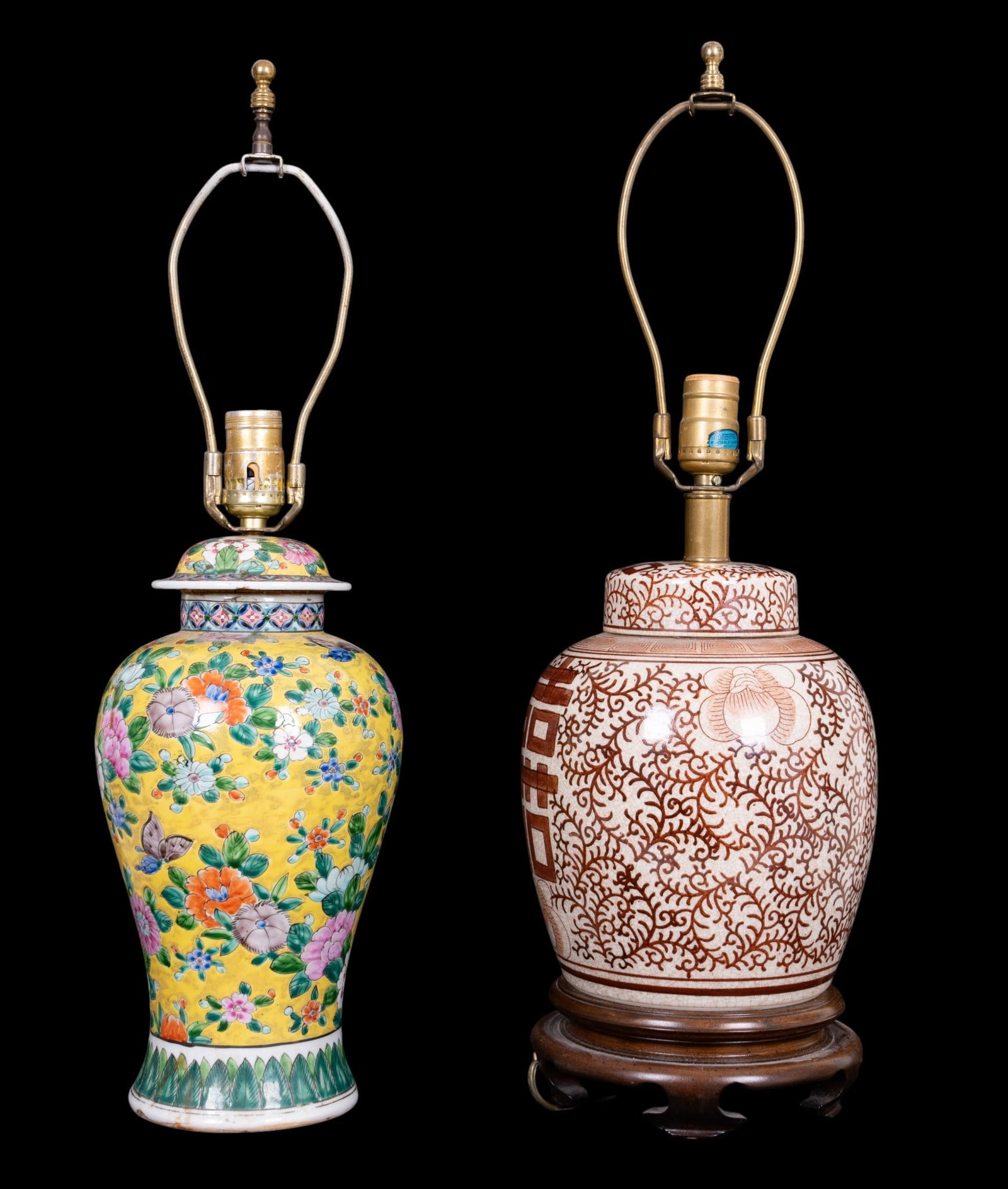Two Asian Table Lamps: Two Asian table lamps, one in a famille rose color palette with yellow ground with floral and butterfly motifs, the other decorated in brown with Double Happiness motifs. Taller measures approx. 26.75