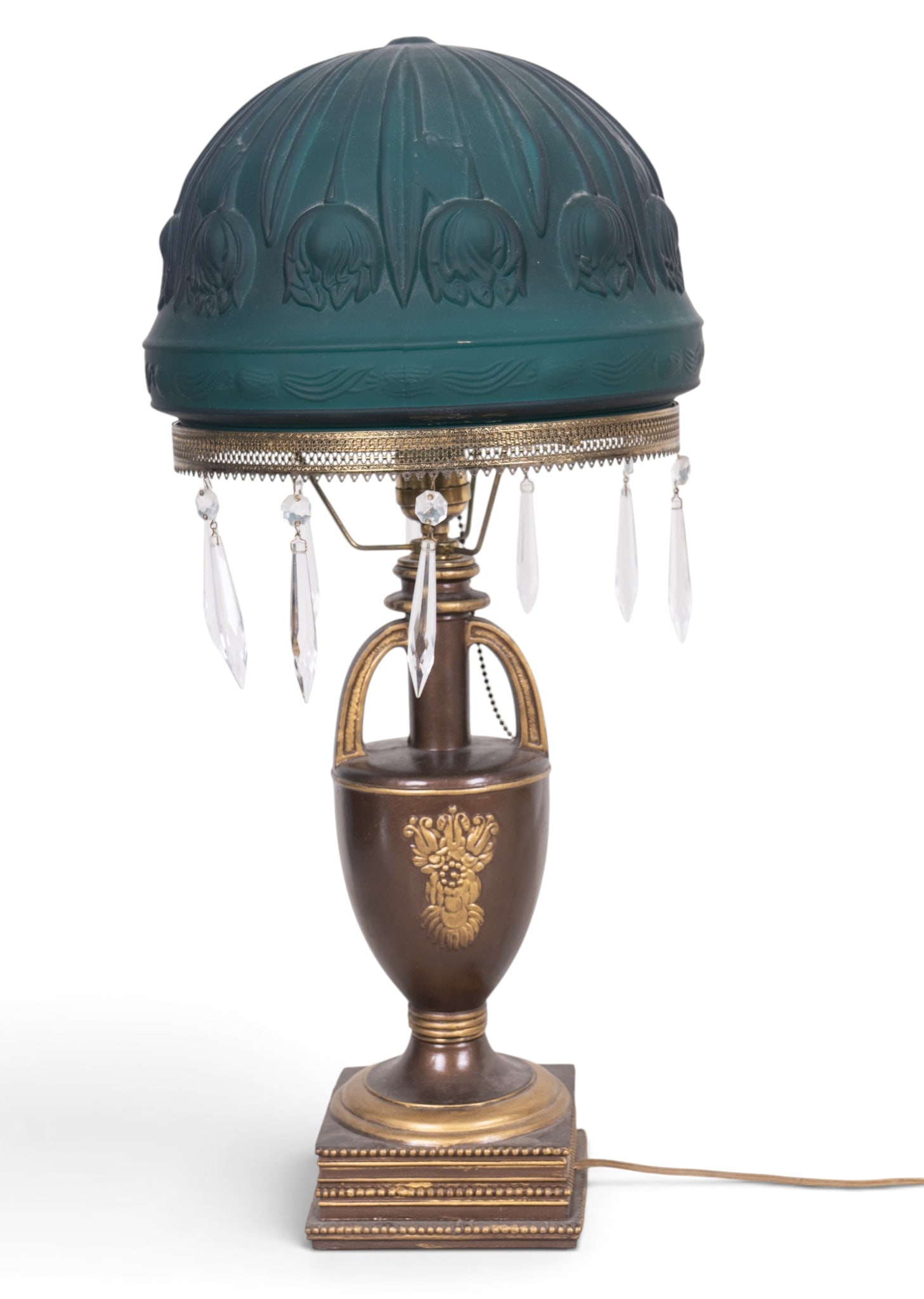 First Half 20th Century Cast Metal Table Lamp: First half 20th century table lamp featuring a cast metal urn-form base with bronze-tone and gilt finish, raised floral decoration and architectural arched supports. Surmounted by a molded dark green 