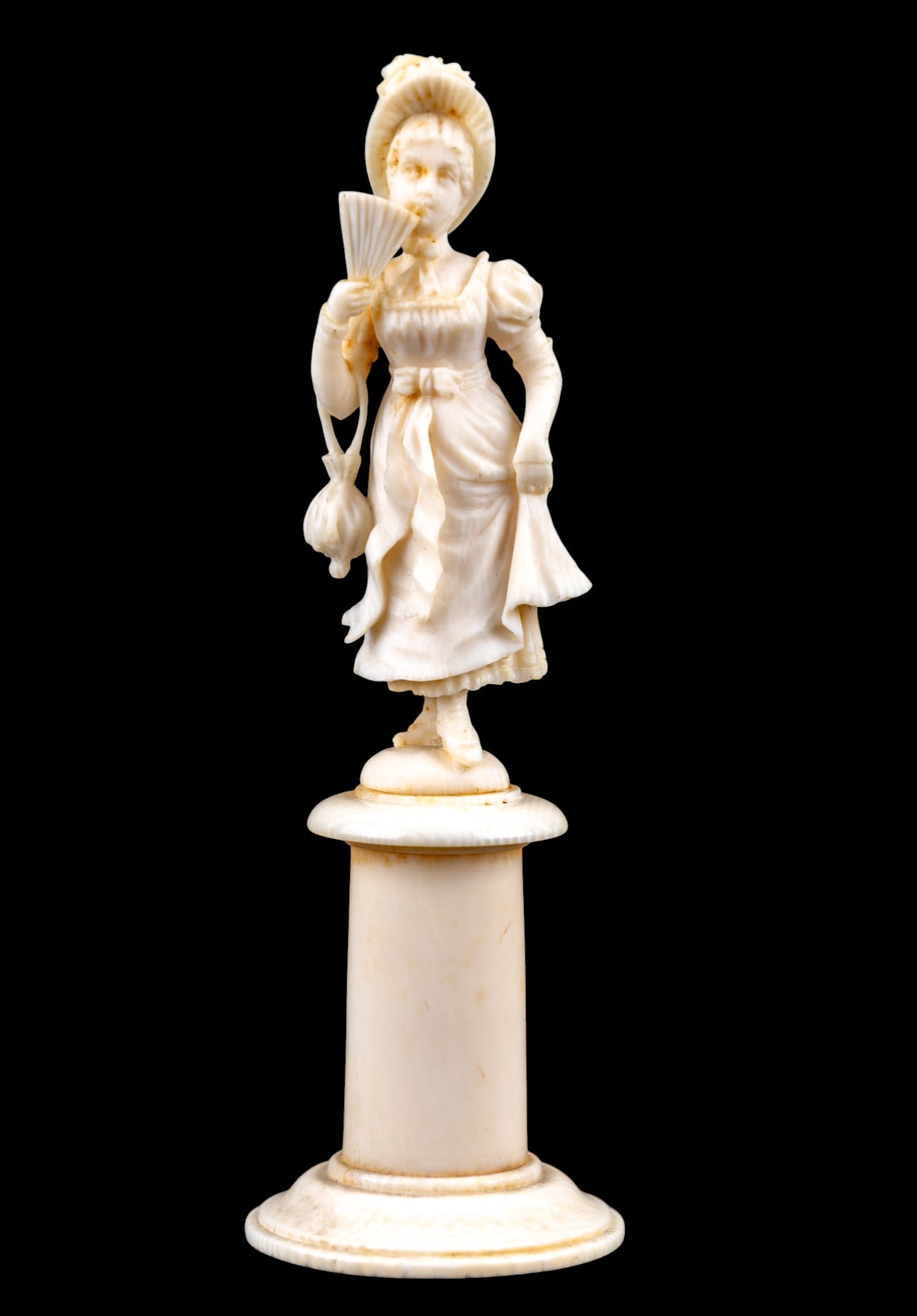 Victorian Carved Figure of Beauty on Pedestal???: Victorian delicately carved natural material miniature statuette depicting a beautiful lady holding a fan, measures approx. 4" H. MUST BE SOLD IN PA ONLY- Item can only be sold to Pennsylvania residen