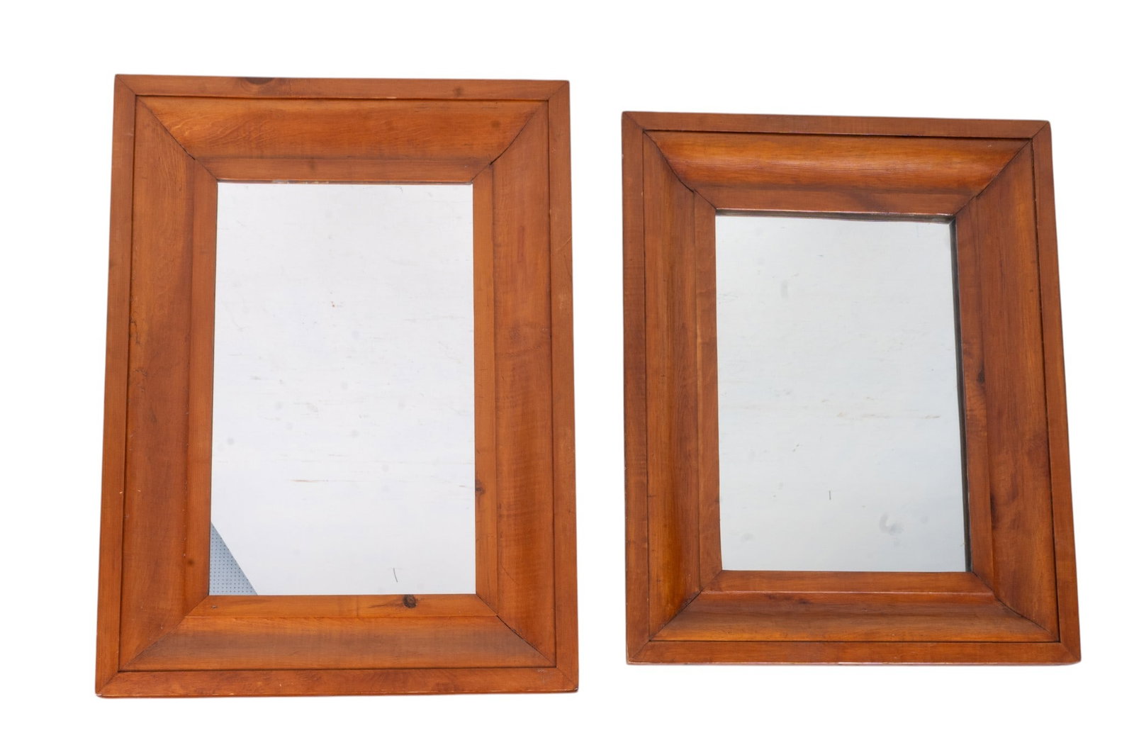 Ogee-Style Mahogany Mirrors: Two Ogee-style beveled mahogany framed wall mirrors, largest measures approx. 29" H x 21" W.