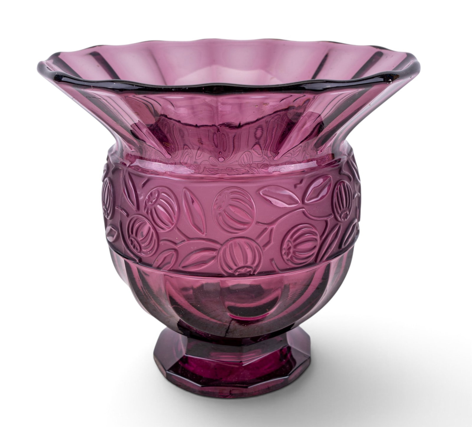 Art Deco Purple Pressed Glass Vase: Vintage art deco style amethyst-colored press glass vase. Vessel has a flared rim and a pressed glass construction with distinct embossed motif. Purple/aubergine colored piece features relief patterns